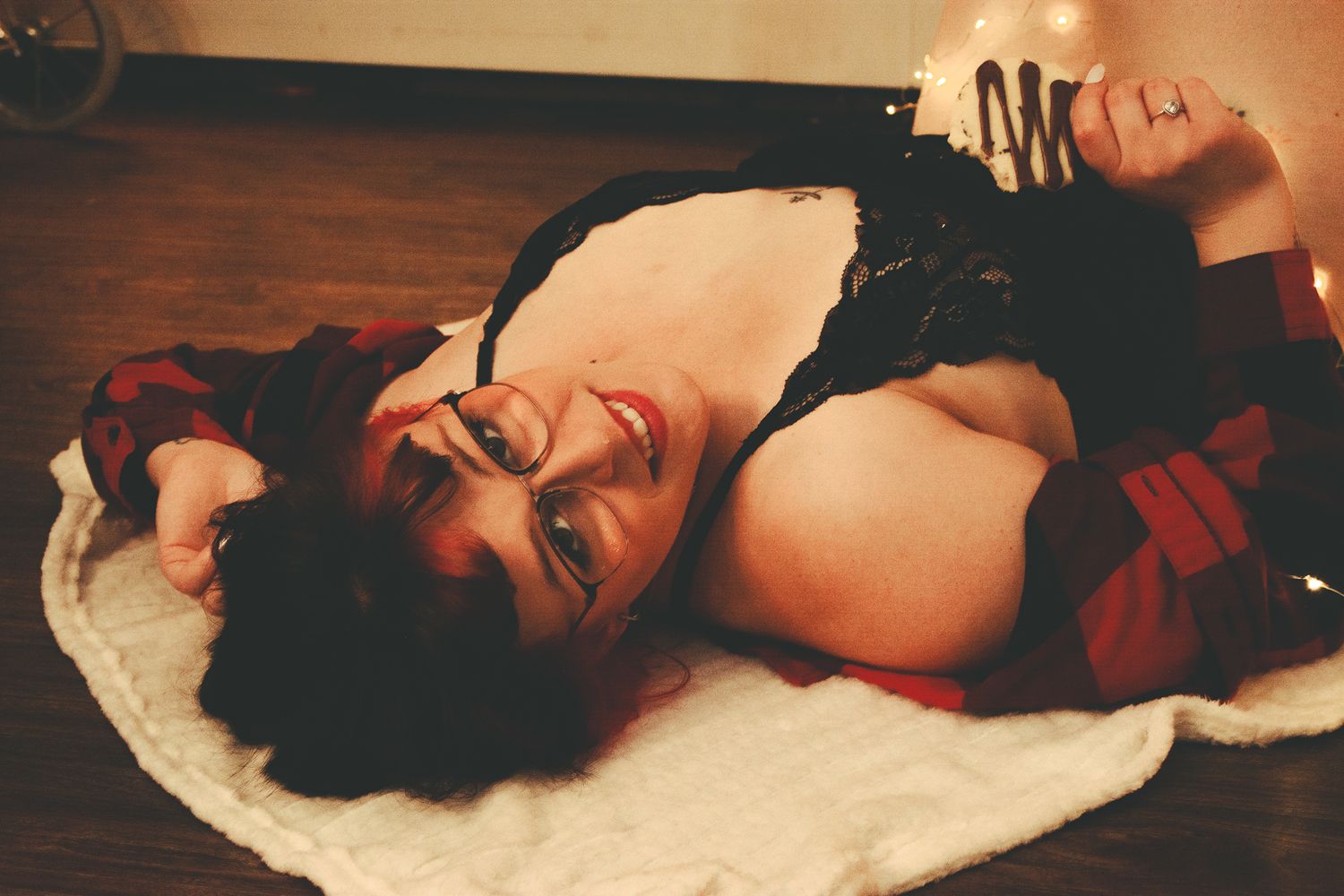 Romantic holiday themed photoshoot with soft lighting and winter decorations.