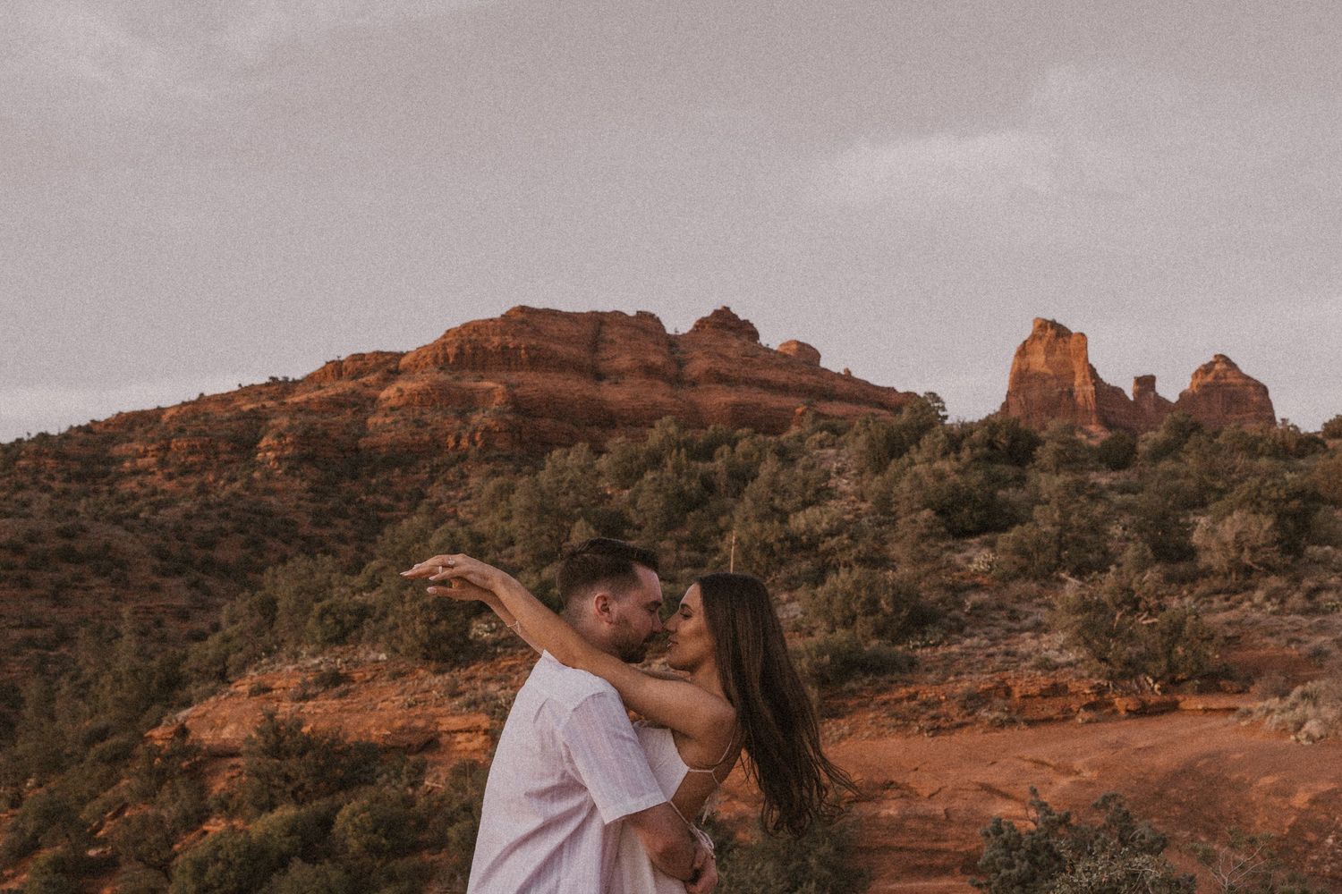 Desert landscapes with red rock formations and cliffs create a dramatic backdrop in this scenic wilderness area.
