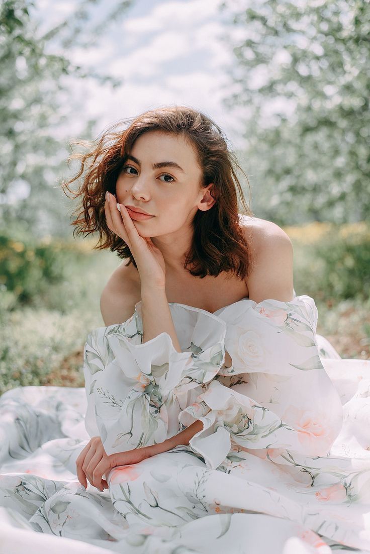 Romantic spring portrait in a floral dress against blooming trees with soft natural lighting and dreamy atmosphere in Seoul