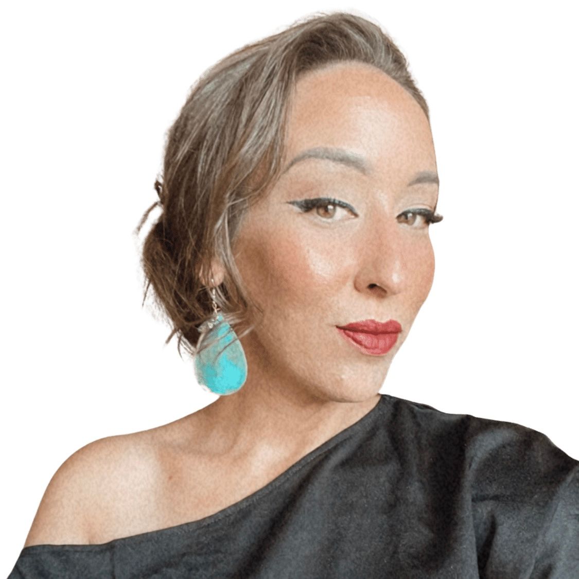 Portrait of someone wearing a black off-shoulder top and turquoise earrings against white background.
