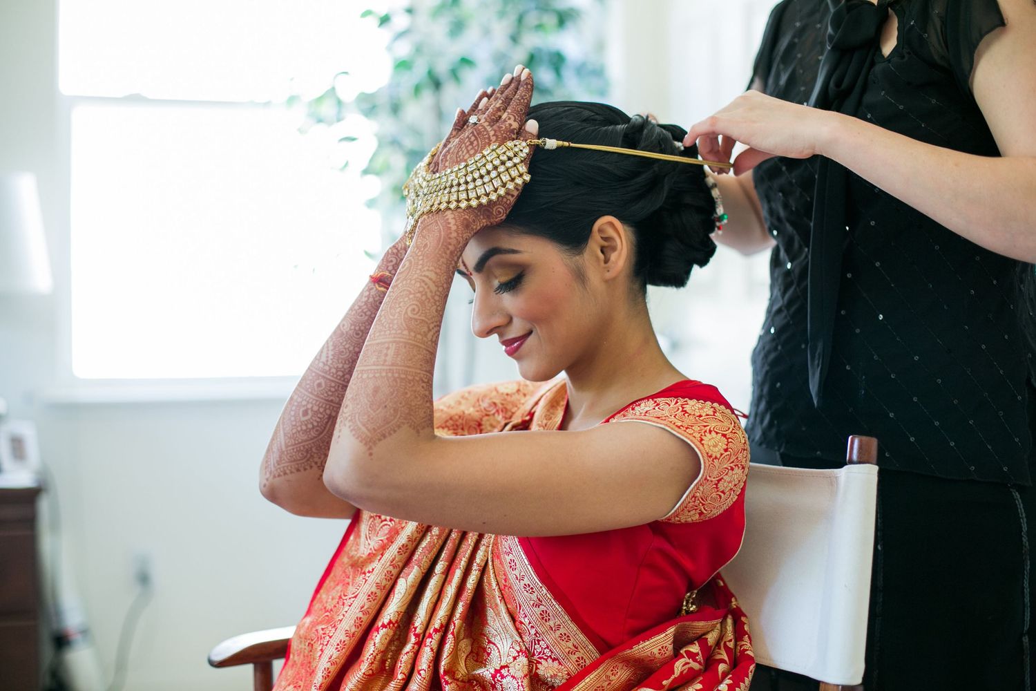 Final wedding preparations with traditional Indian bridal accessories and jewelry.