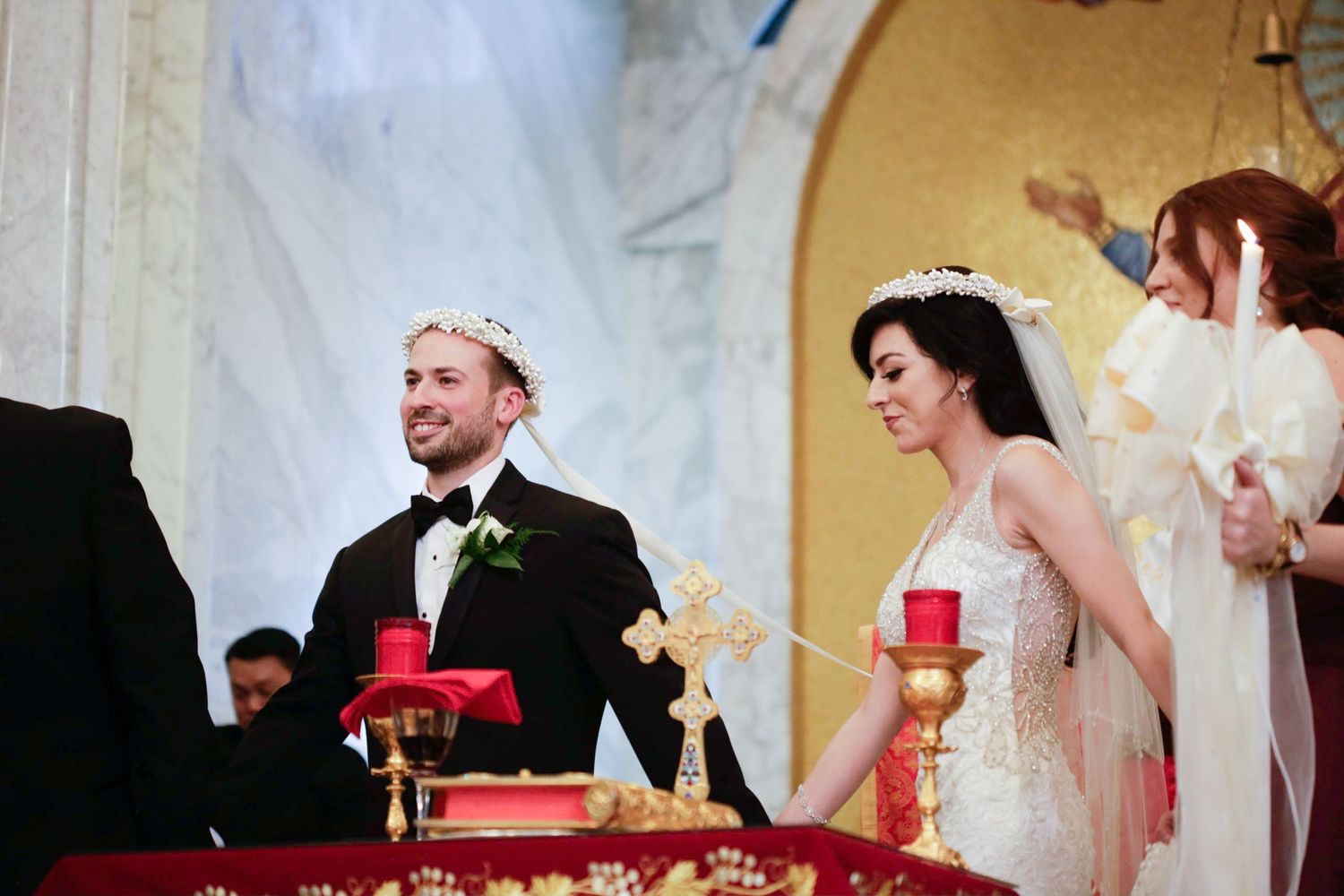 Wedding reception scene with elegant table settings and decor.
