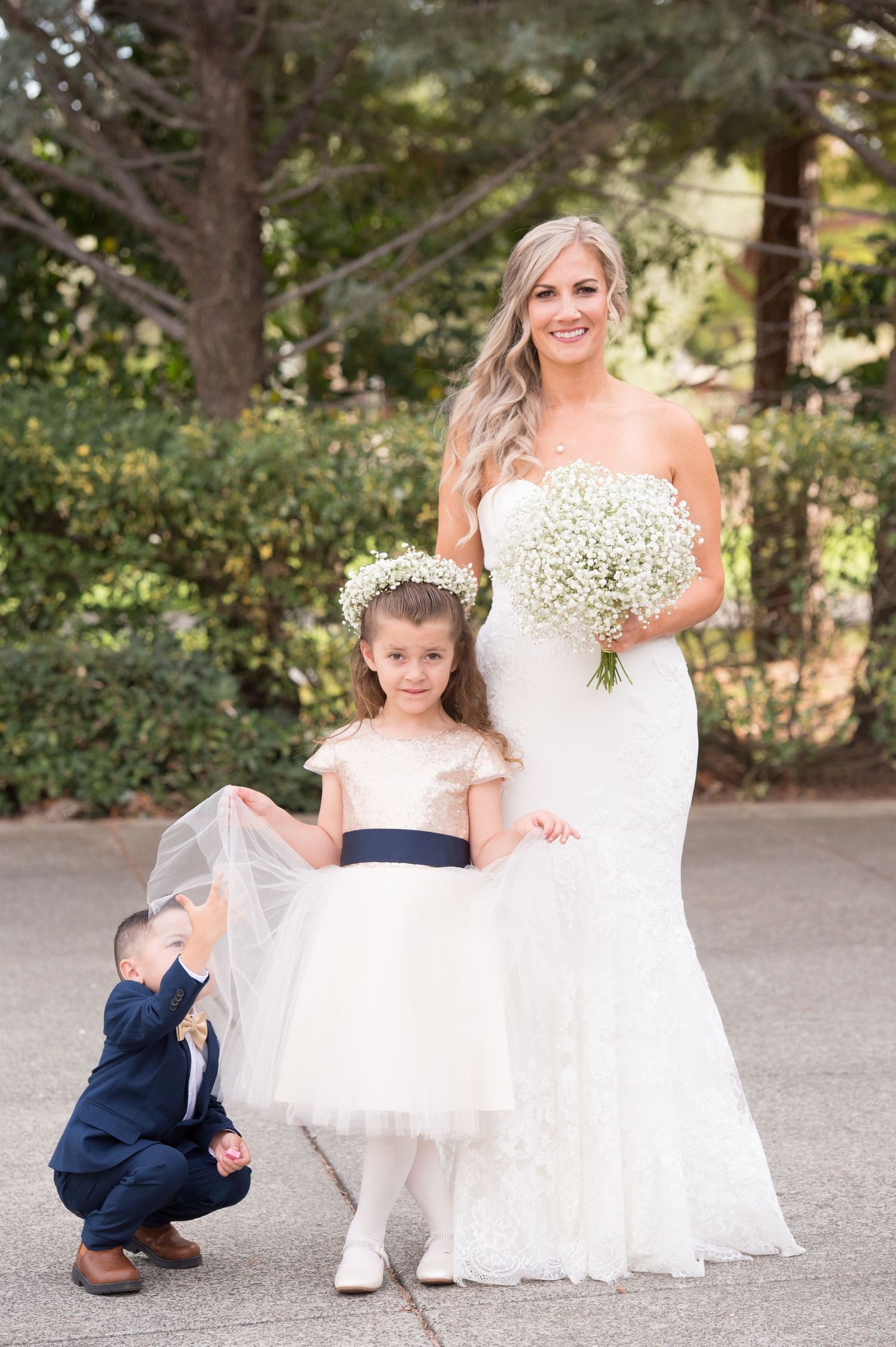Elegant outdoor wedding portrait with white baby's breath bouquet.