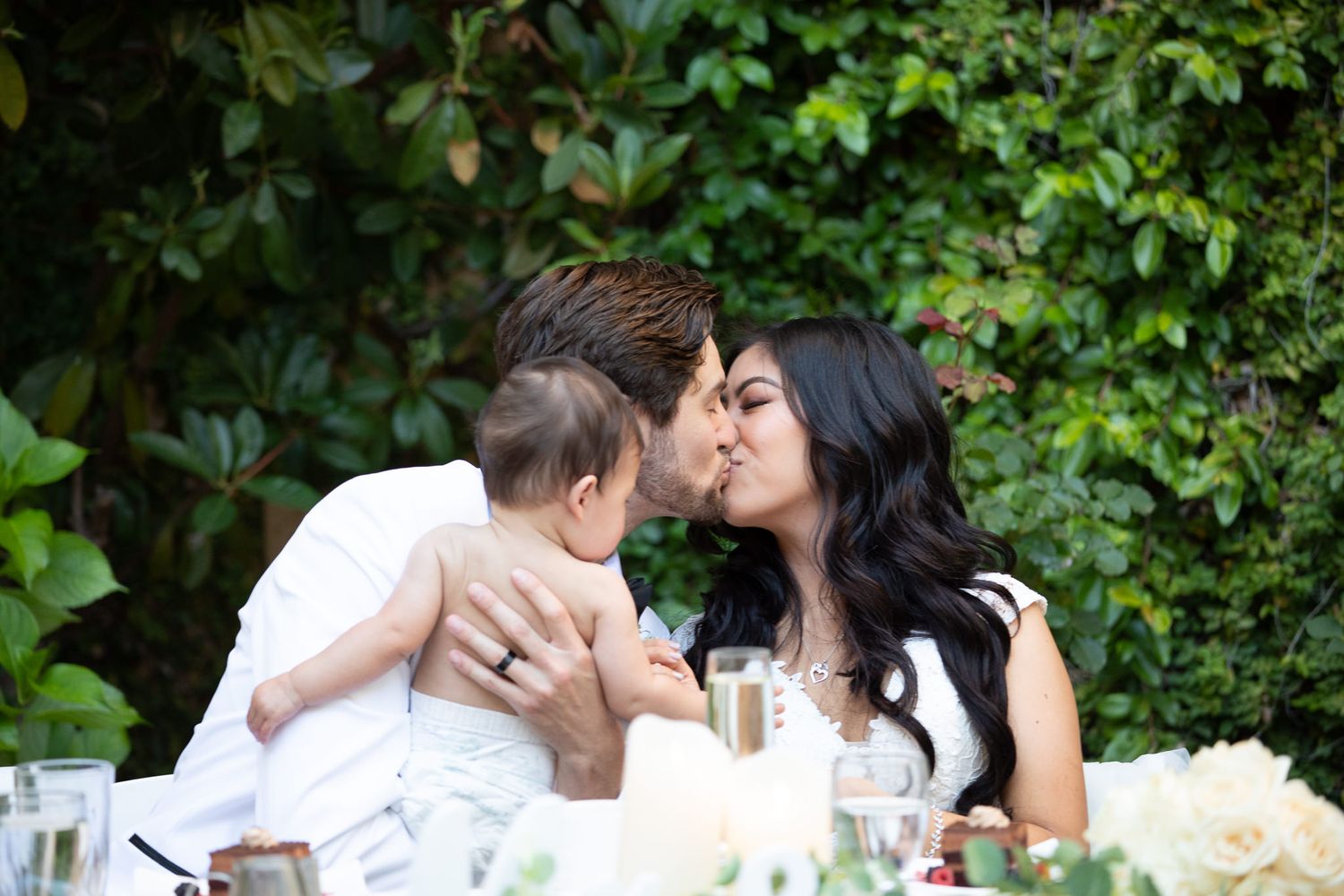 An intimate moment shared between a couple during their wedding reception.