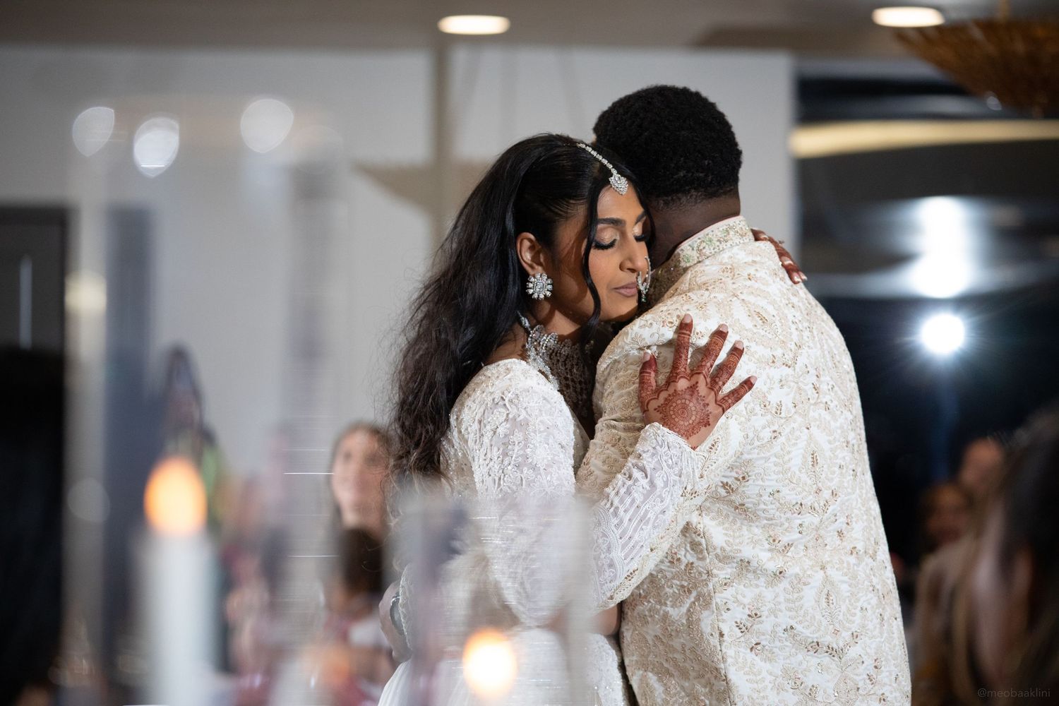 Intimate first dance moment captured in soft indoor lighting.