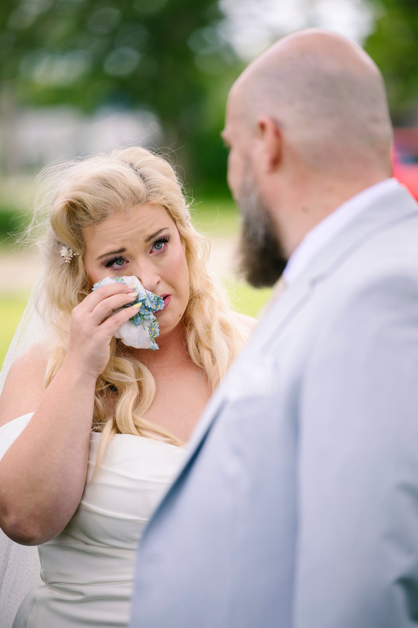 A sequence of emotional expressions shared during an intimate outdoor moment under natural lighting.