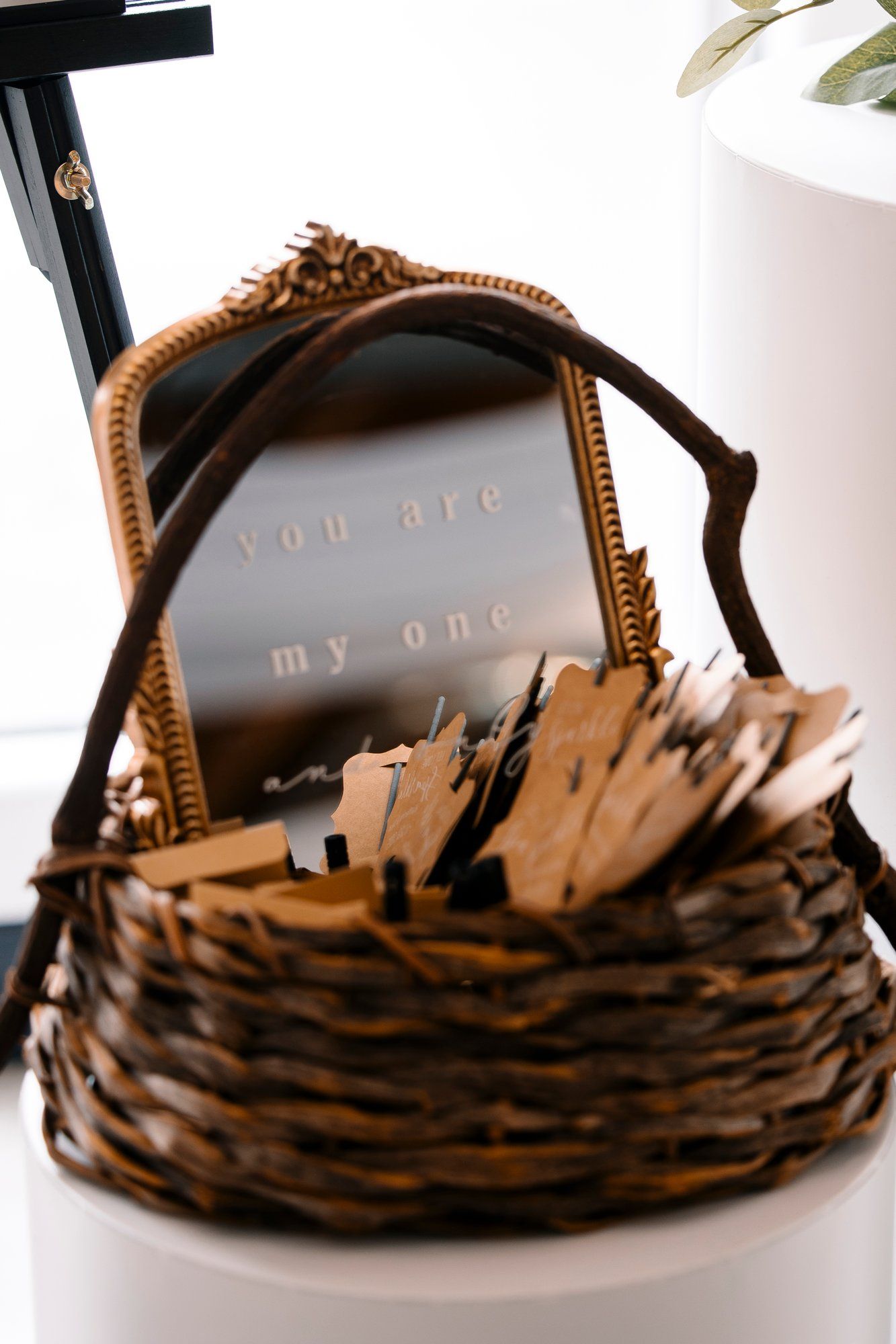 Artistic arrangement of dark brown vow books with textured covers displayed in a minimalist style.