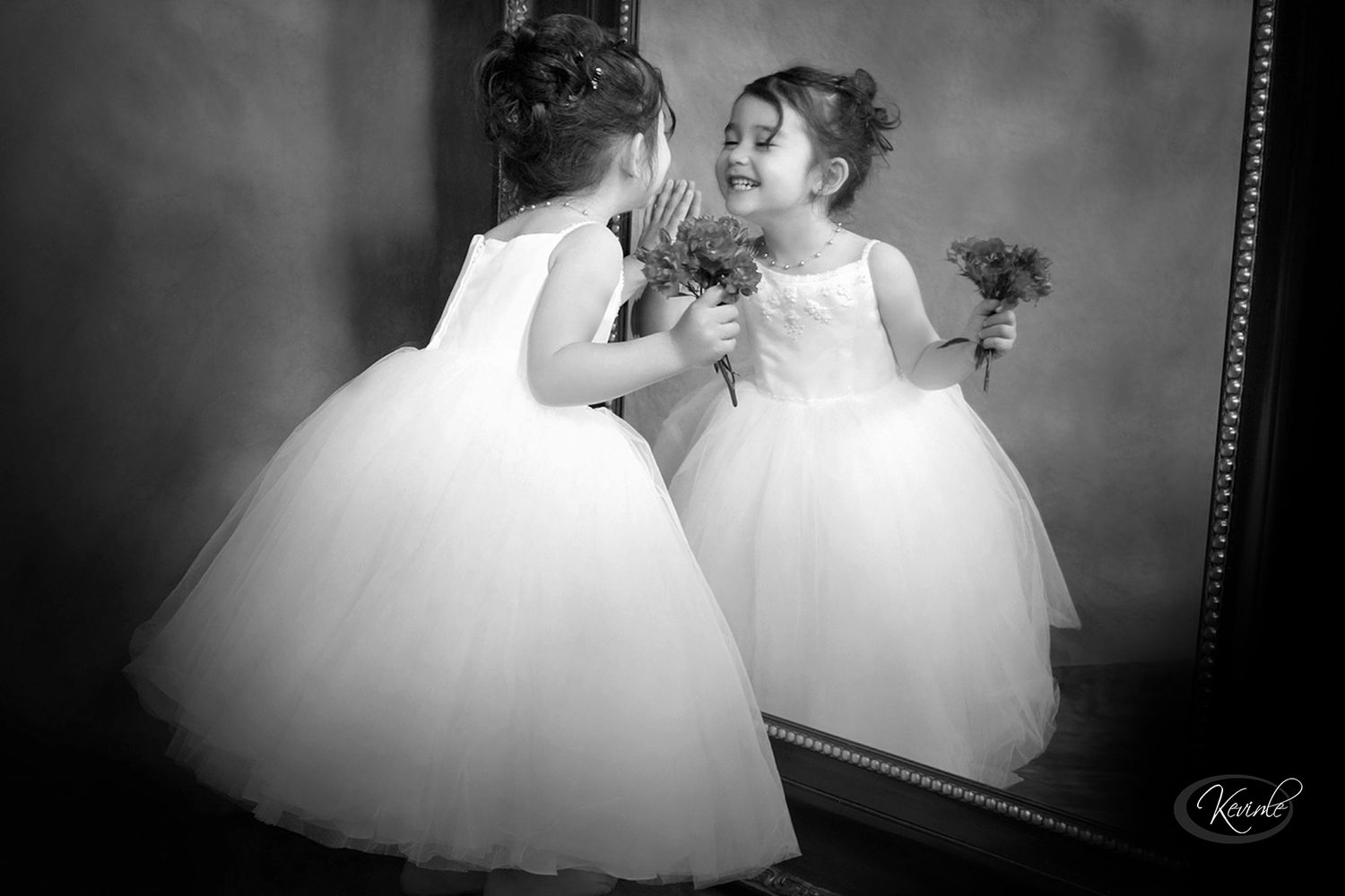 Black and white intimate wedding portraits with soft romantic lighting.