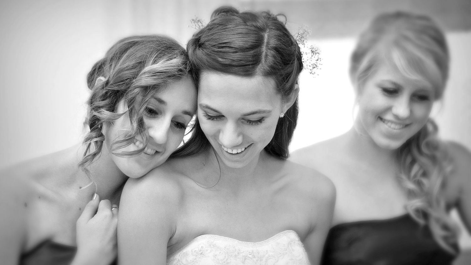 Black and white collage of bridal preparations showing candid joy and laughter among wedding party.