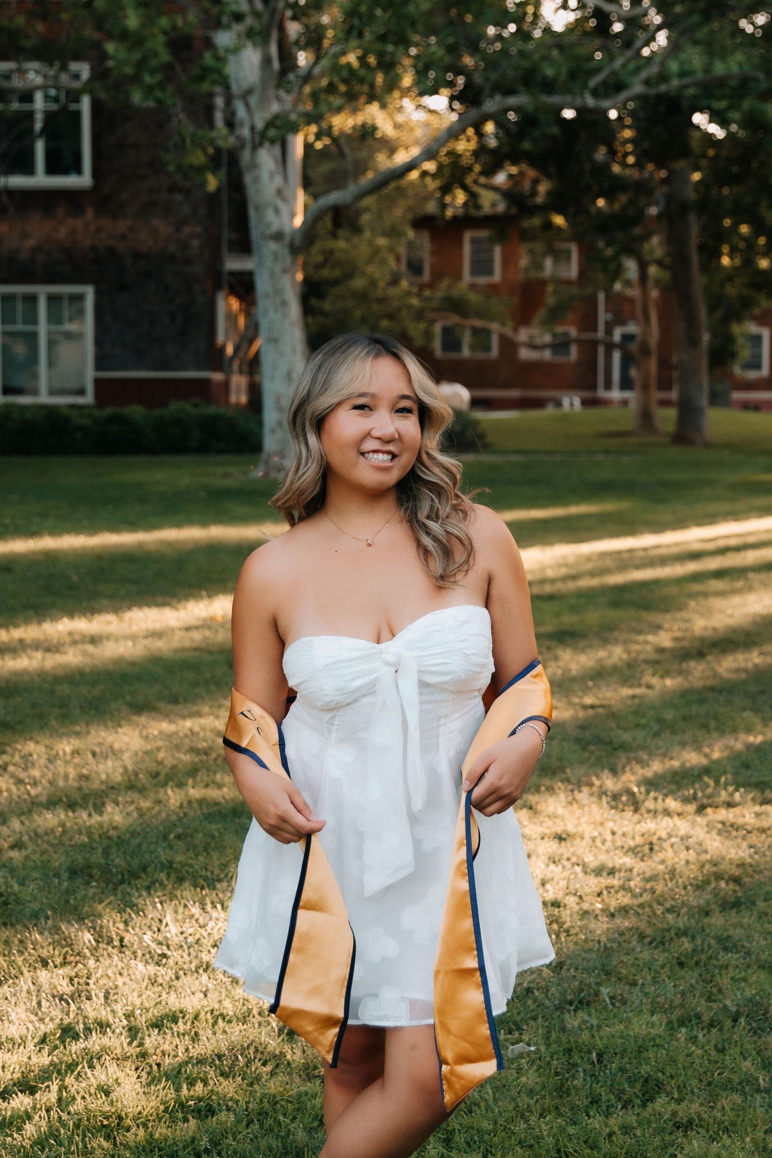 A series of outdoor portrait photos featuring a person in a white off-shoulder top during golden hour sunlight.