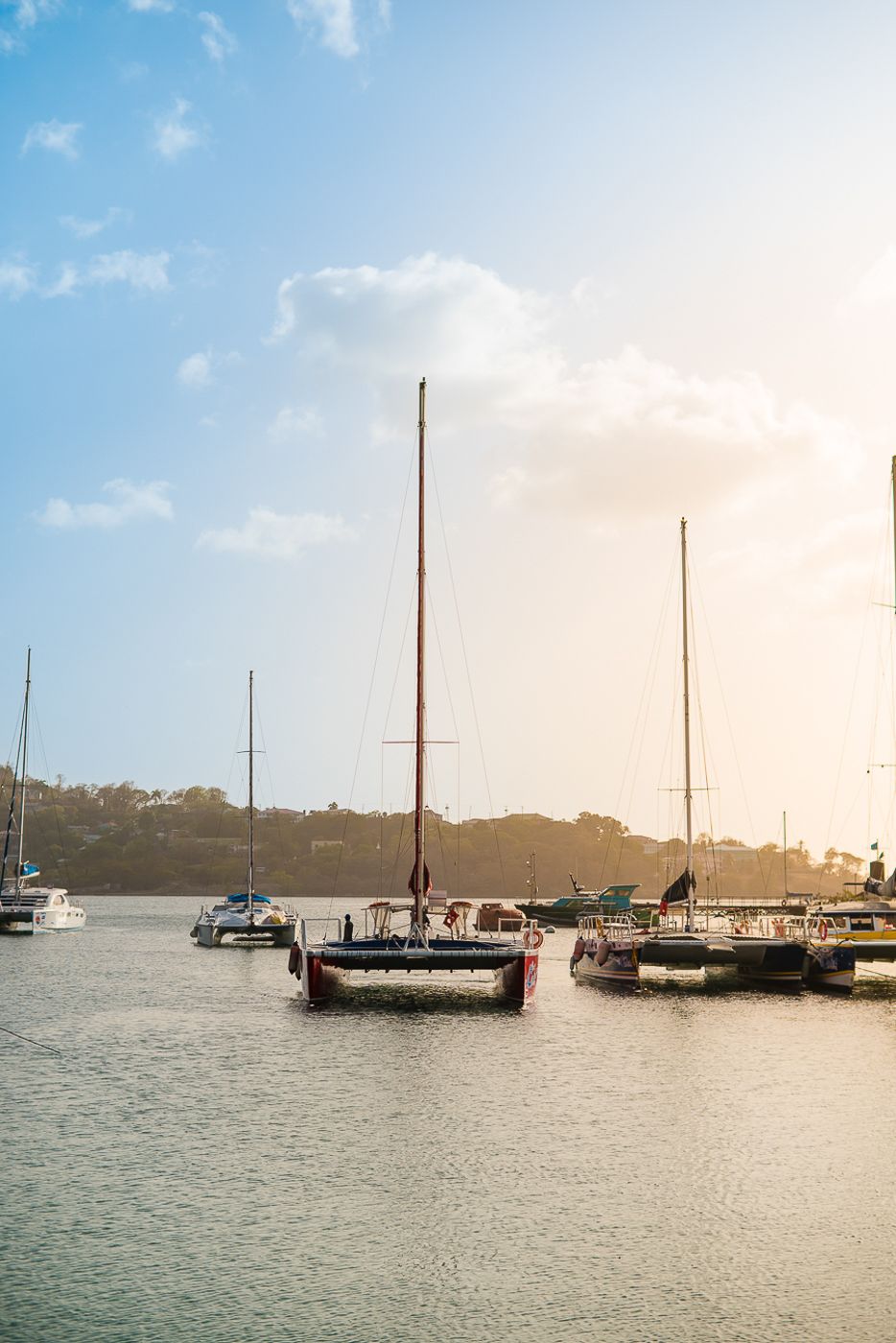 Caribbean wedding photographers Celeste & Reece documenting the couple’s cruise on a catamaran off the coast of Barbados, Caribbean