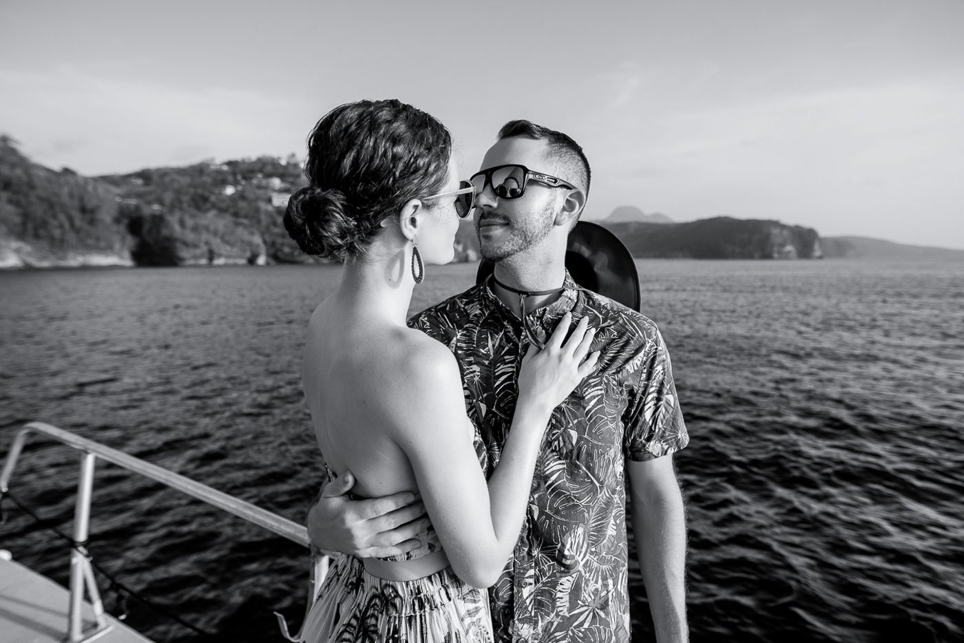 Barbados wedding photographers Celeste & Reece capturing the couple on a catamaran for their post wedding sunset cruise at Sandals Resorts