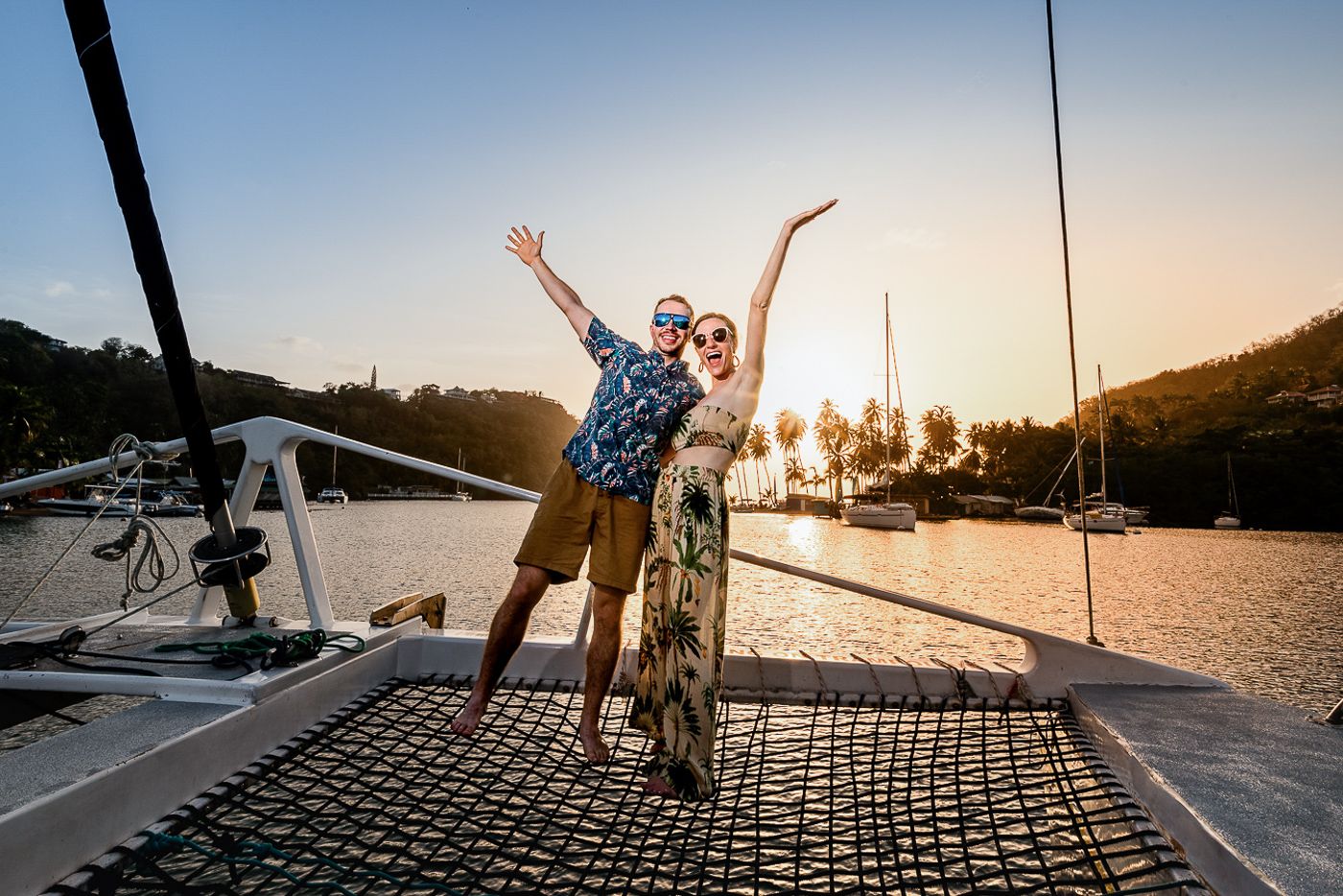 Saint Lucia wedding photographers capturing the couple on a catamaran for their post wedding sunset cruise at Sandals Resorts