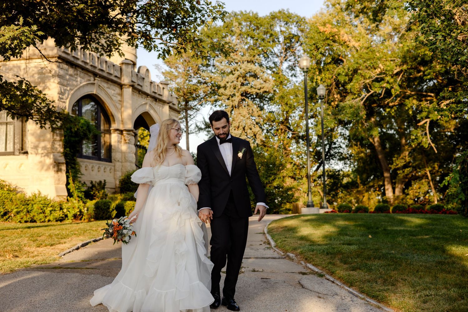 Bride and groom captured at golden hour in Joslyn Castle Gardens, Omaha