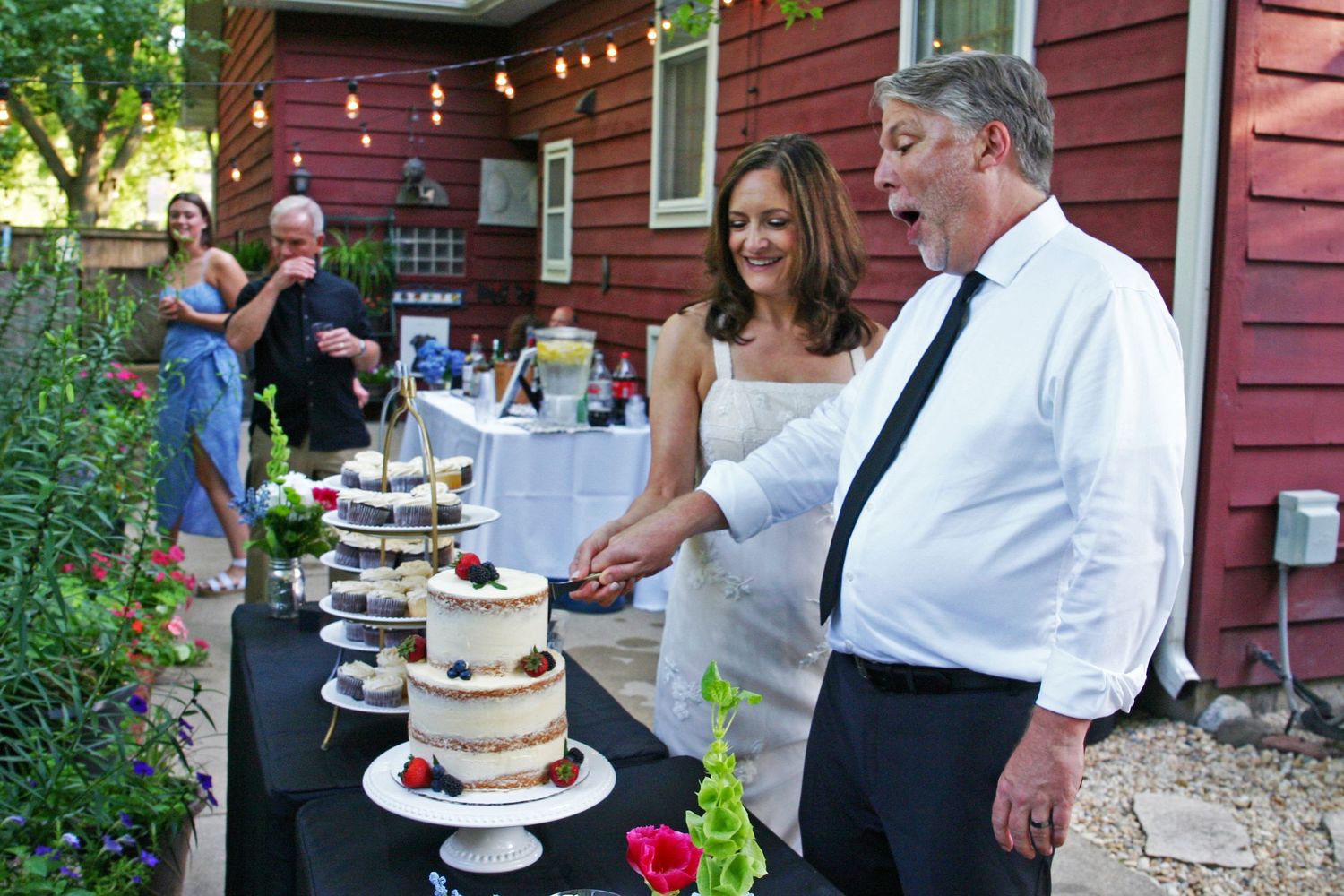 Jackie and Rob Vinopal cut the cake at their wedding