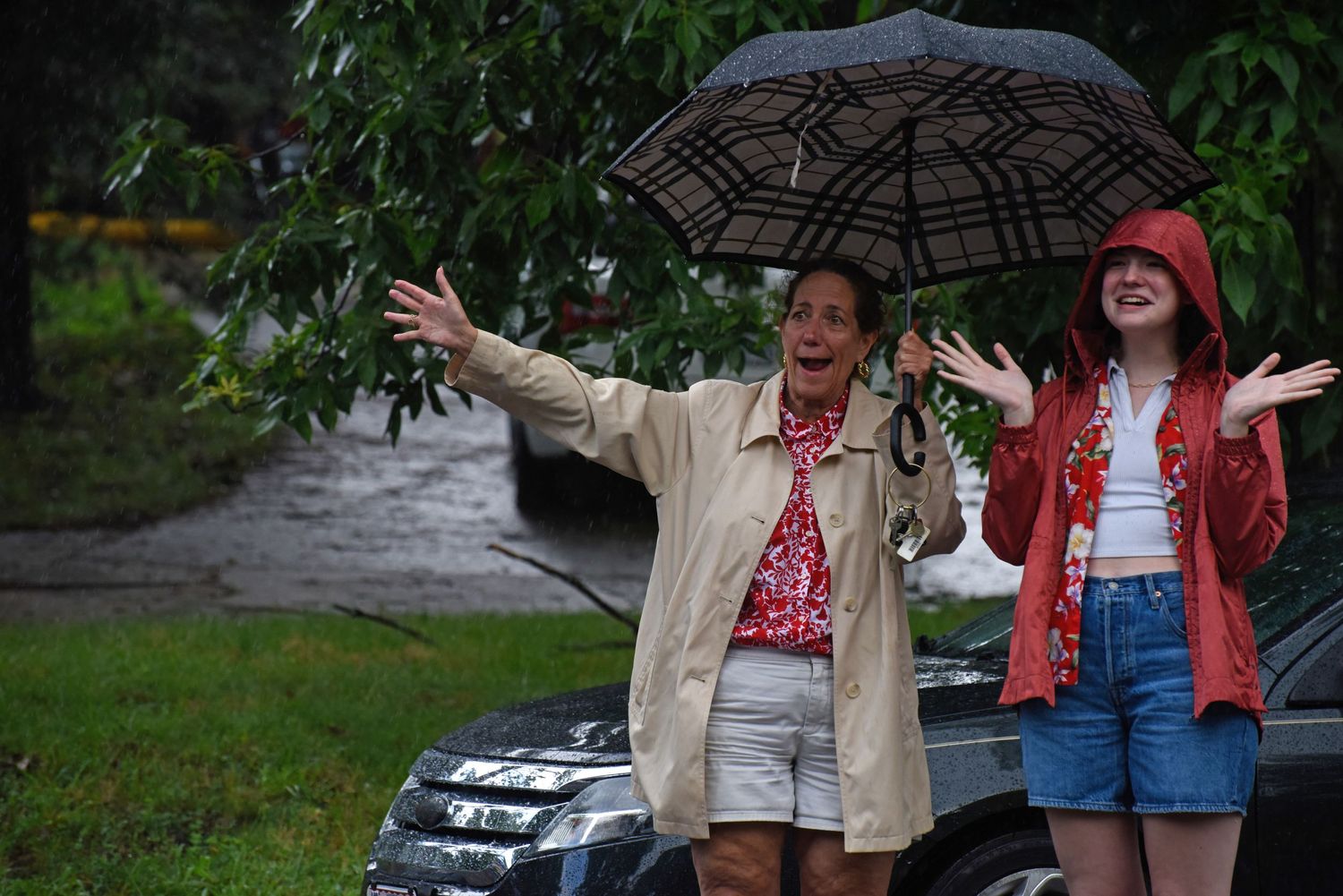 Lynda Kraxberger, left, and Lou Kraxberger watch the parade from a side street Thursday at Russell Boulevard Elementary School.