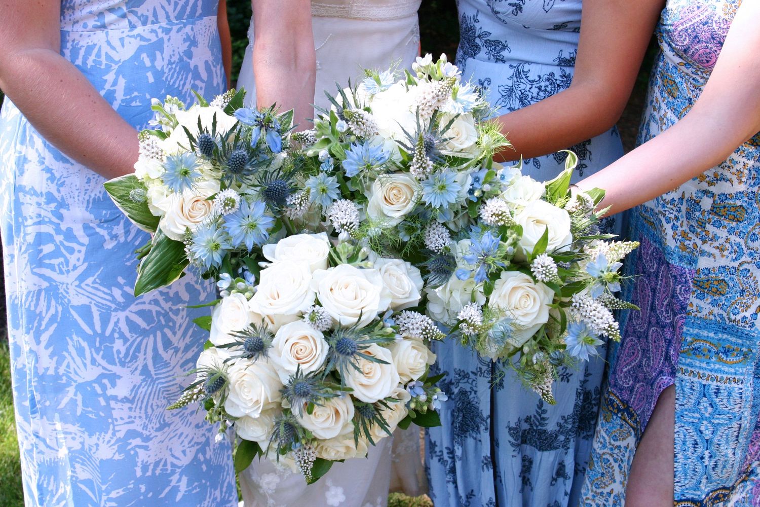 Jackie and her bridesmaids push their bouquets together before her wedding to Rob.