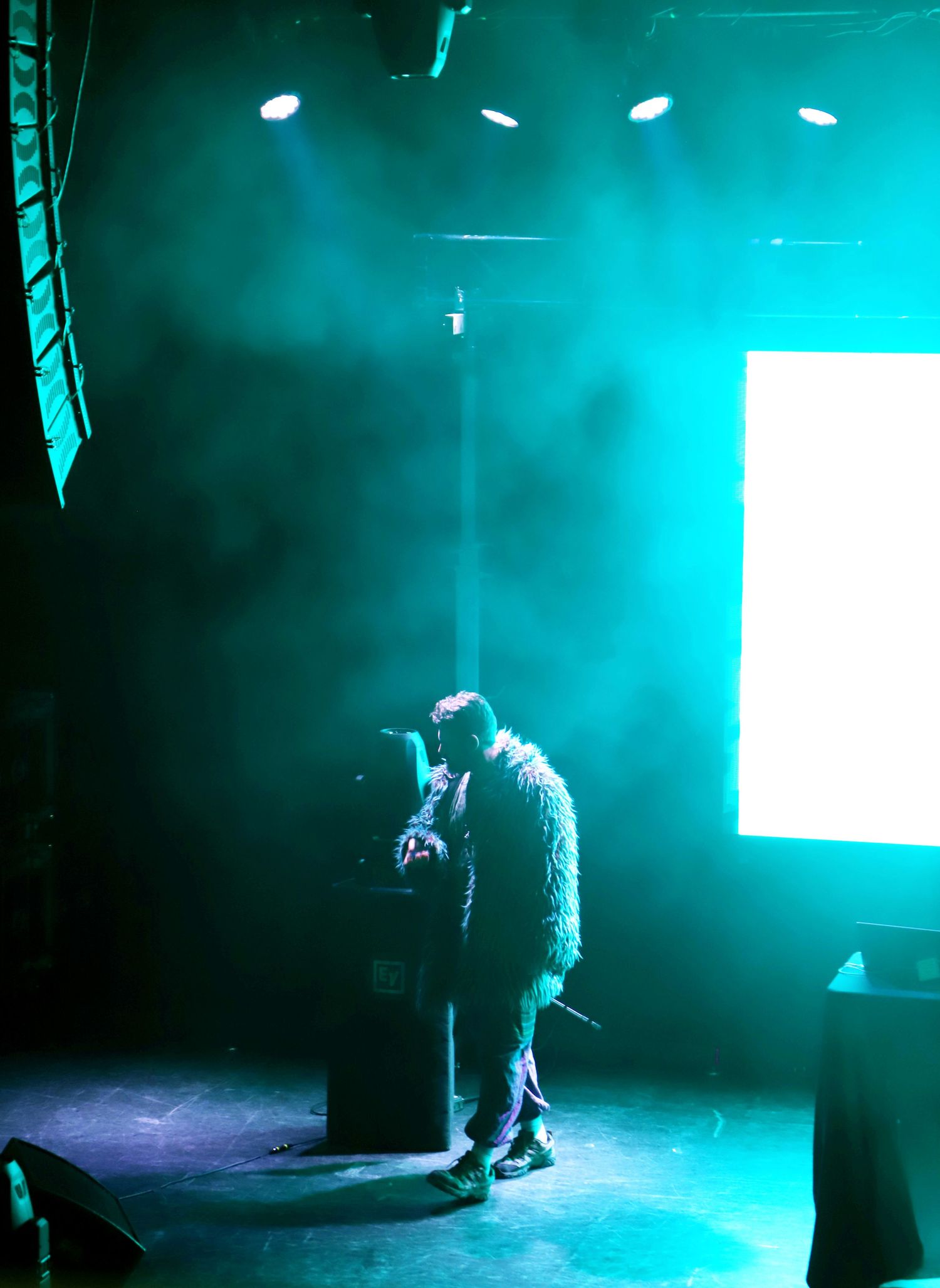 A man stands on stage at the Blue Note in Columbia Missouri.