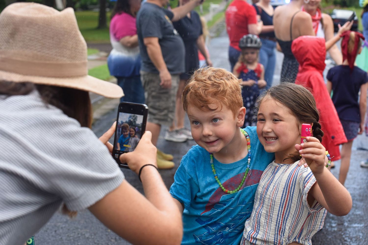 essica Pelzer, left, takes a picture of Finn Gauthier, 6, and Eleanor Pelzer, 6, after the Fourth of July Children’s Parade.