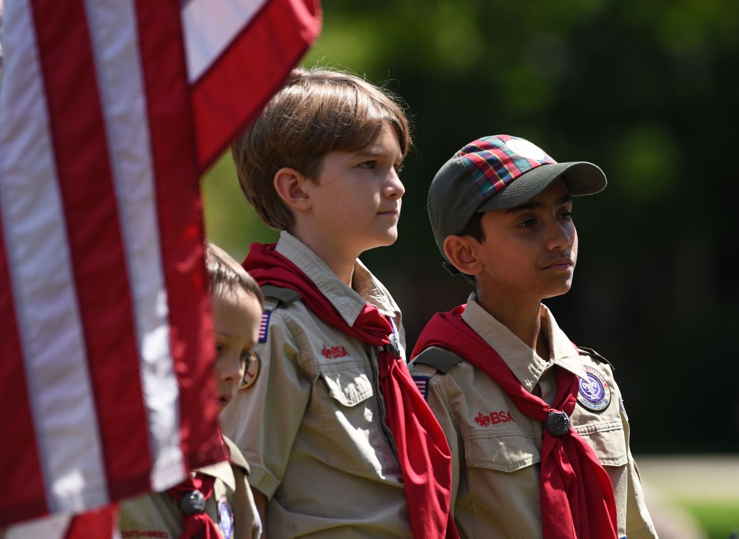 Two boy scouts stand Saturday during a ceremony marking the 80th anniversary of D-Day and honoring Gen. Omar Bradley at Rothwell Park in Mob