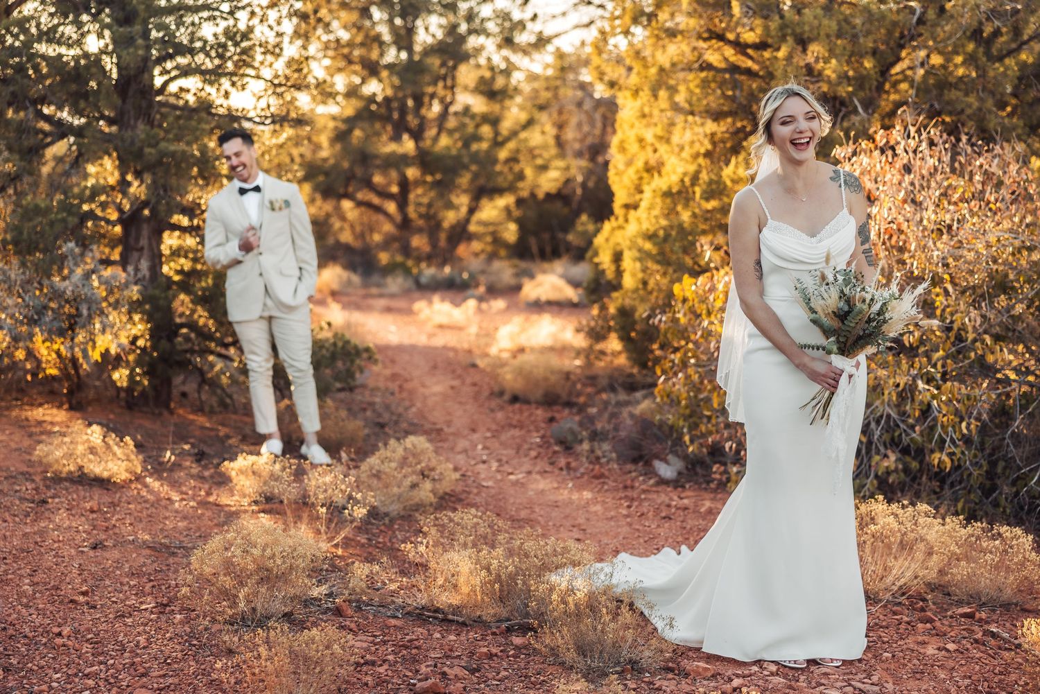 A collection of golden hour wedding photos on a rustic dirt path surrounded by autumn foliage.
