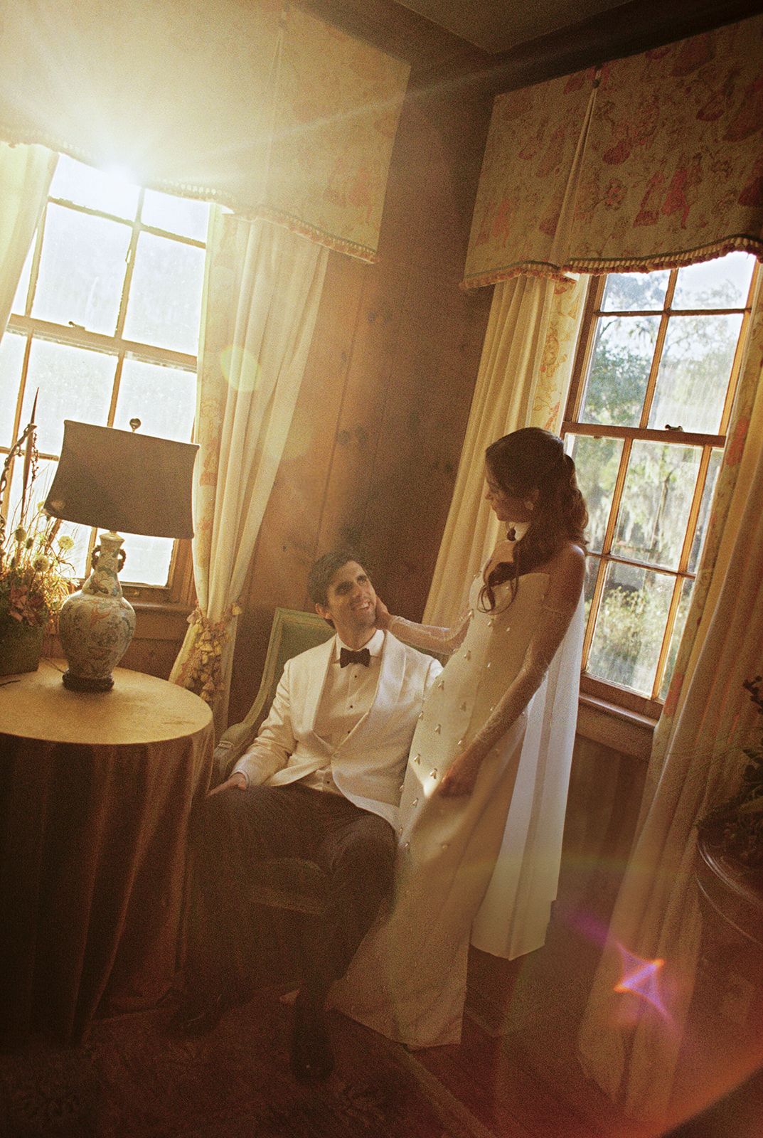A sequence of images showing a figure in white by sunlit windows in what appears to be a vintage interior setting.