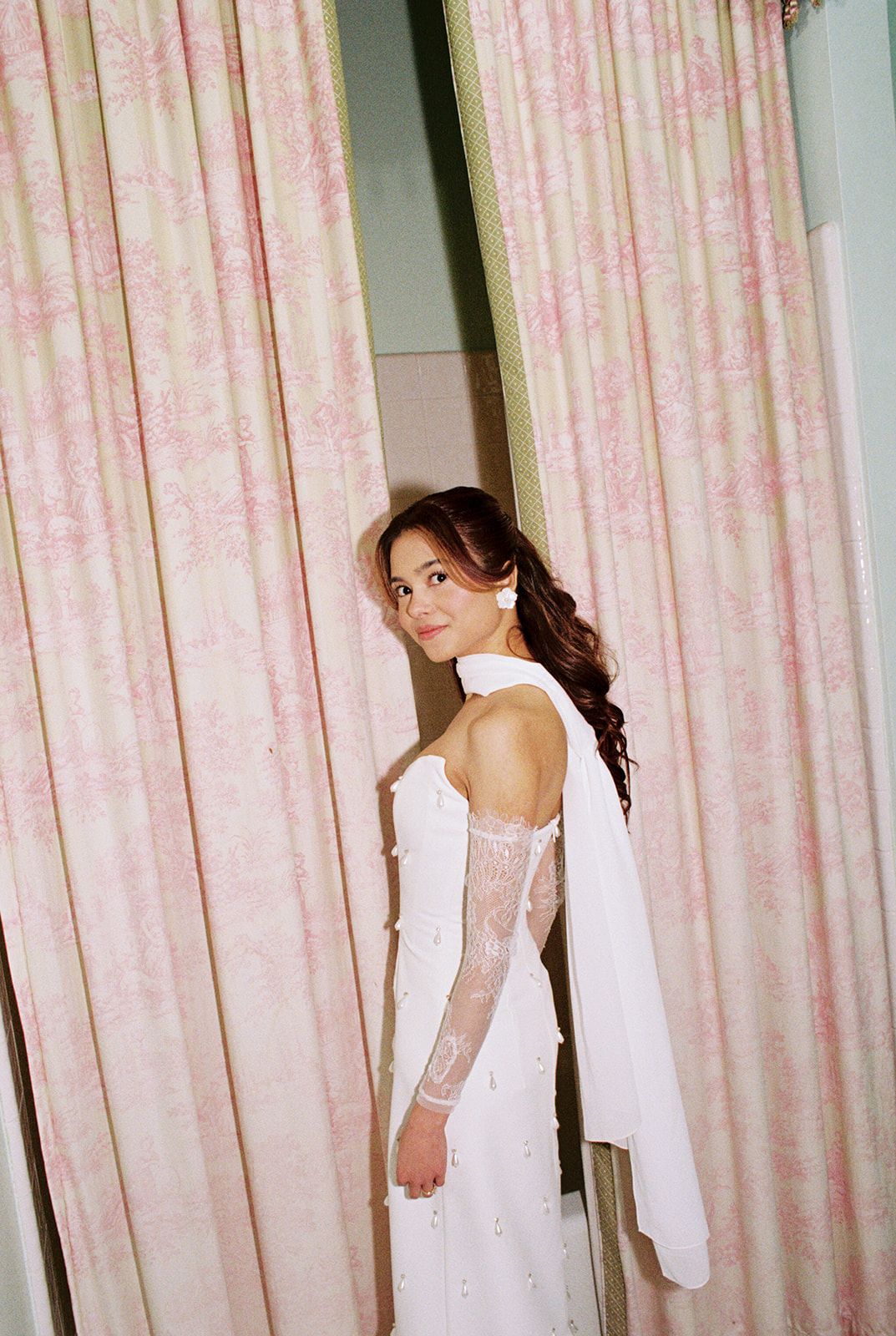 Mirror reflection collage showing a bride in a low-back white lace wedding dress with hair styled in an elegant updo.