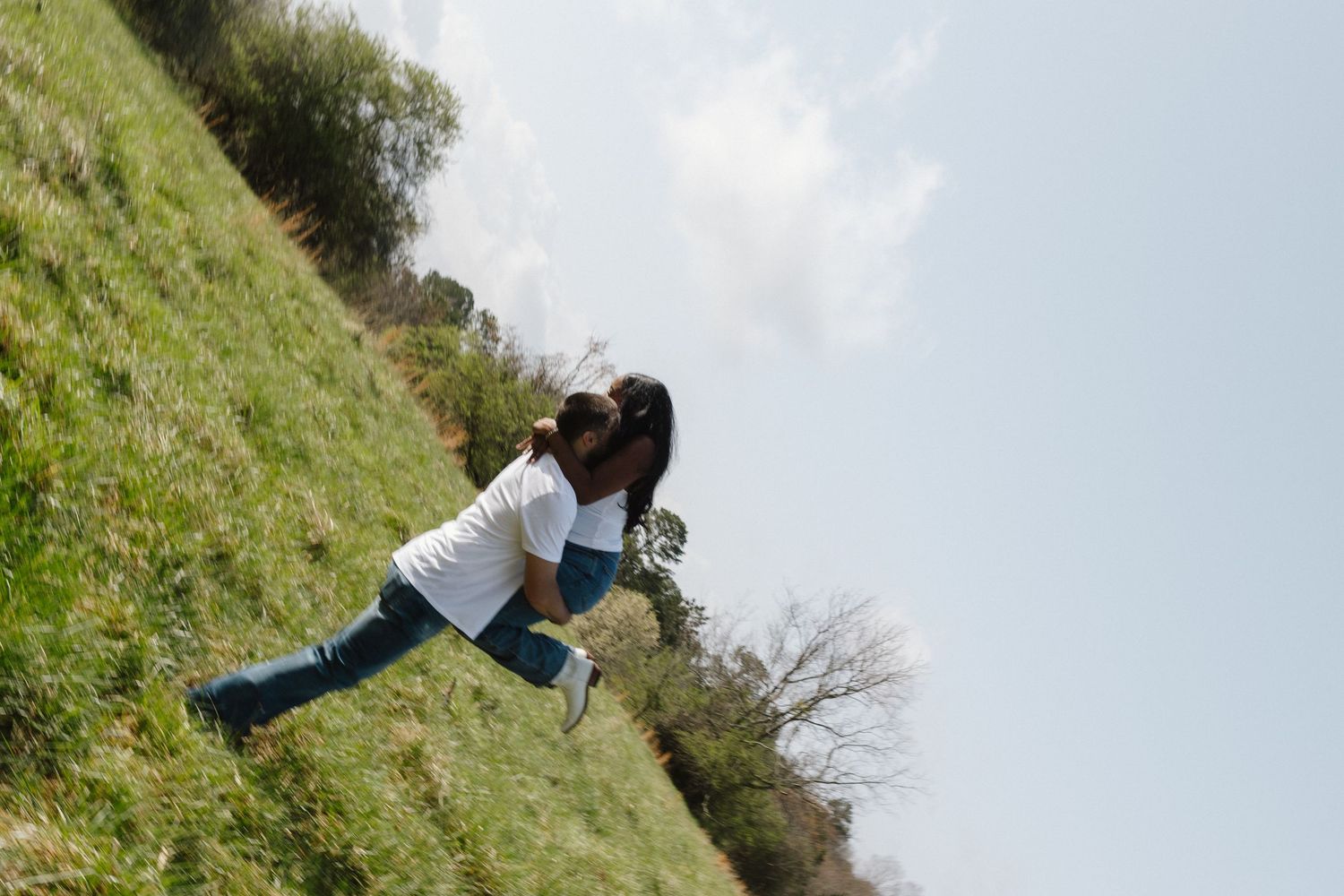 A series of interconnected photos shows someone falling down a grassy hillside slope in a sequential motion.