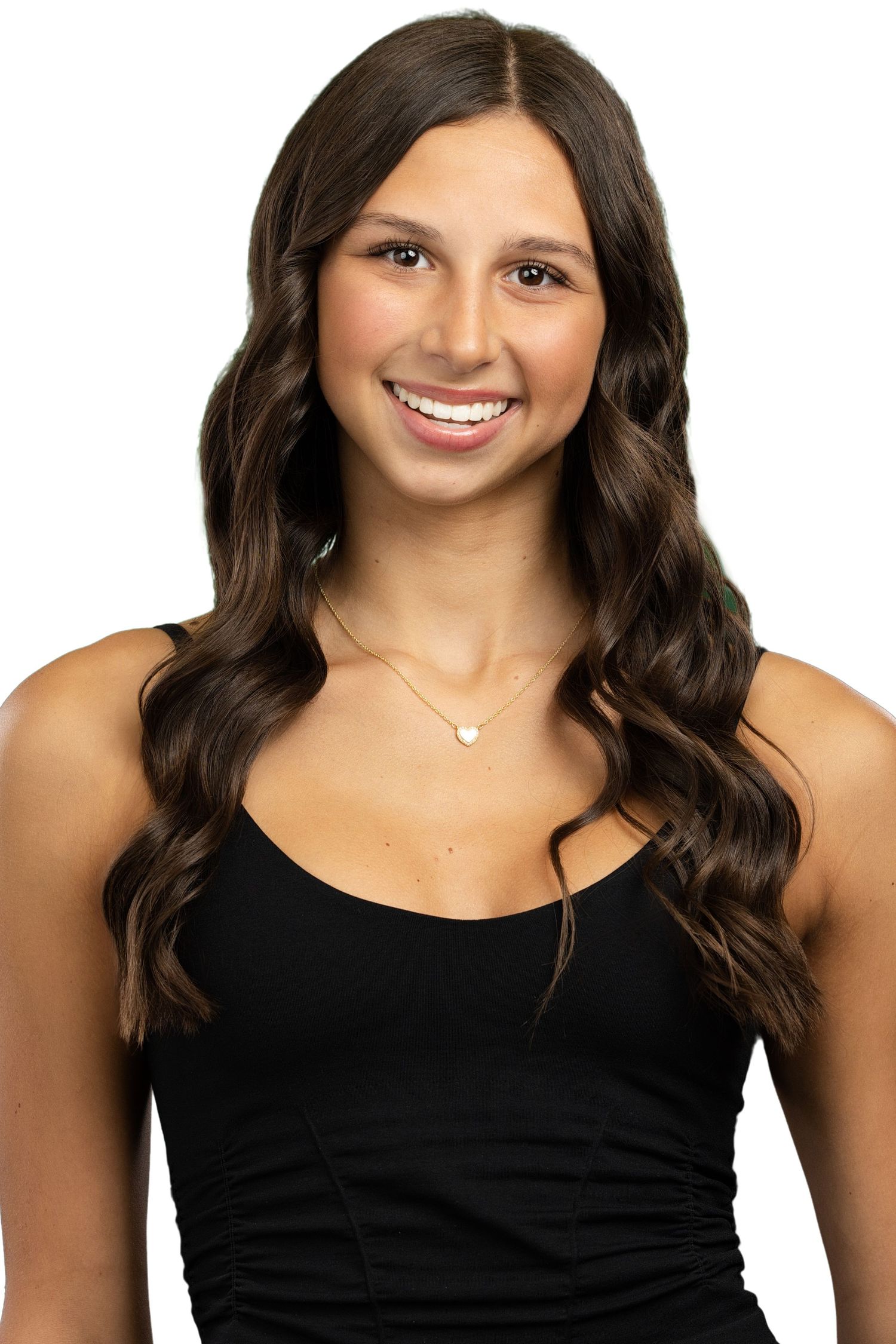 Professional headshot of woman in black tank top with long wavy dark hair and delicate necklace against white background.