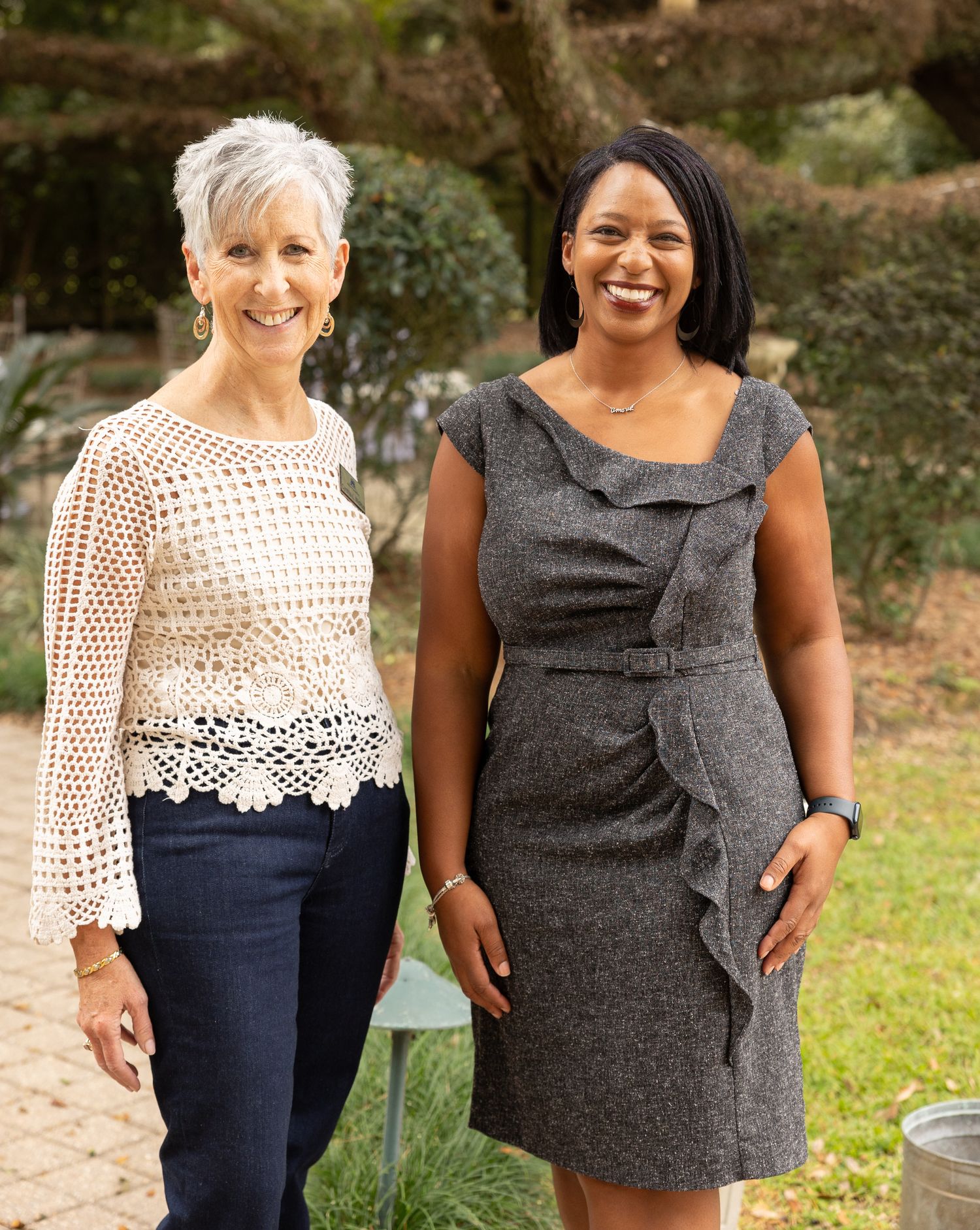 A photo taken outdoors showing two people standing together at PWST Phenomenal Women's Retreat in Covington, Louisiana.