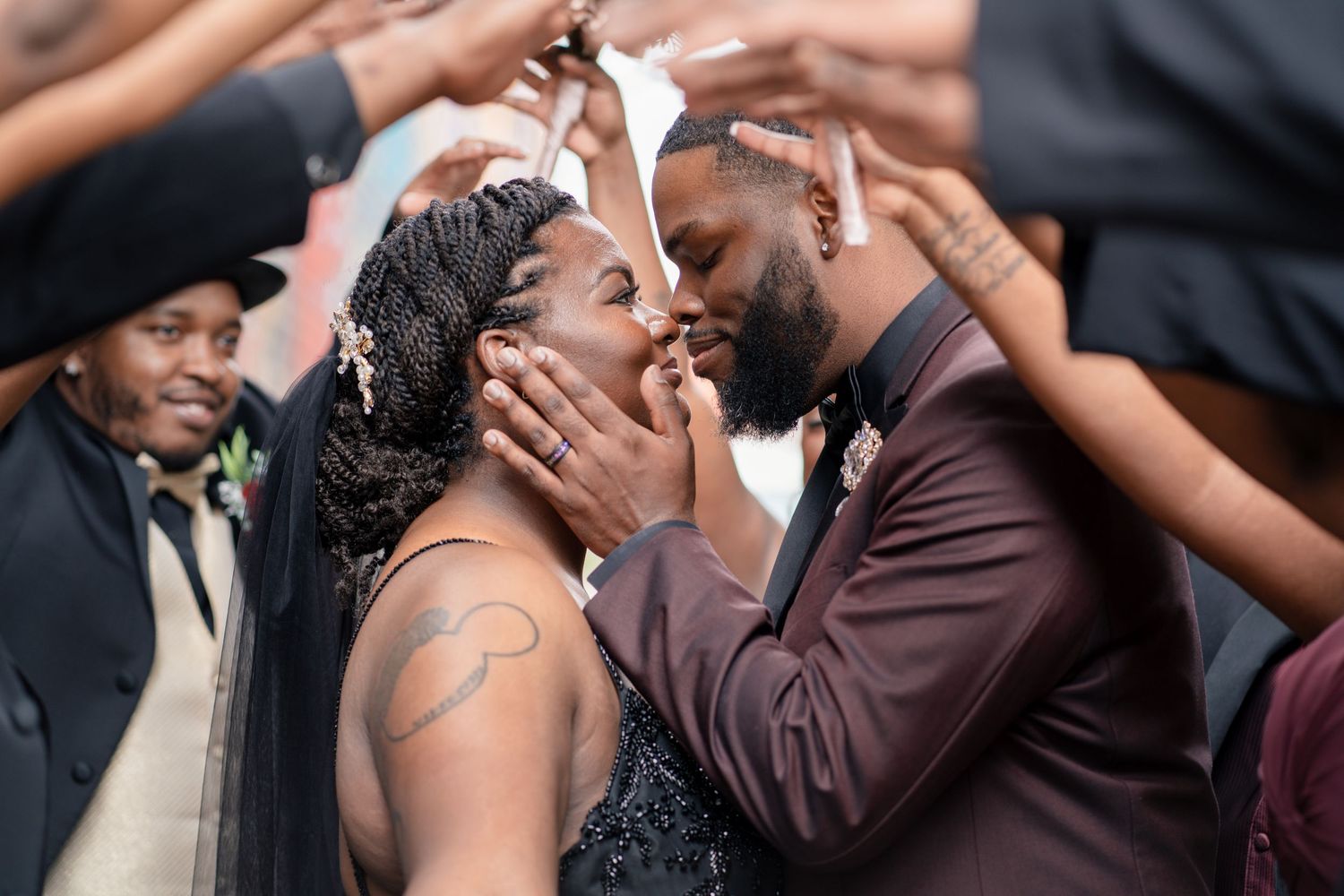 Three photos showing an emotional wedding moment where a couple embraces passionately during their ceremony.