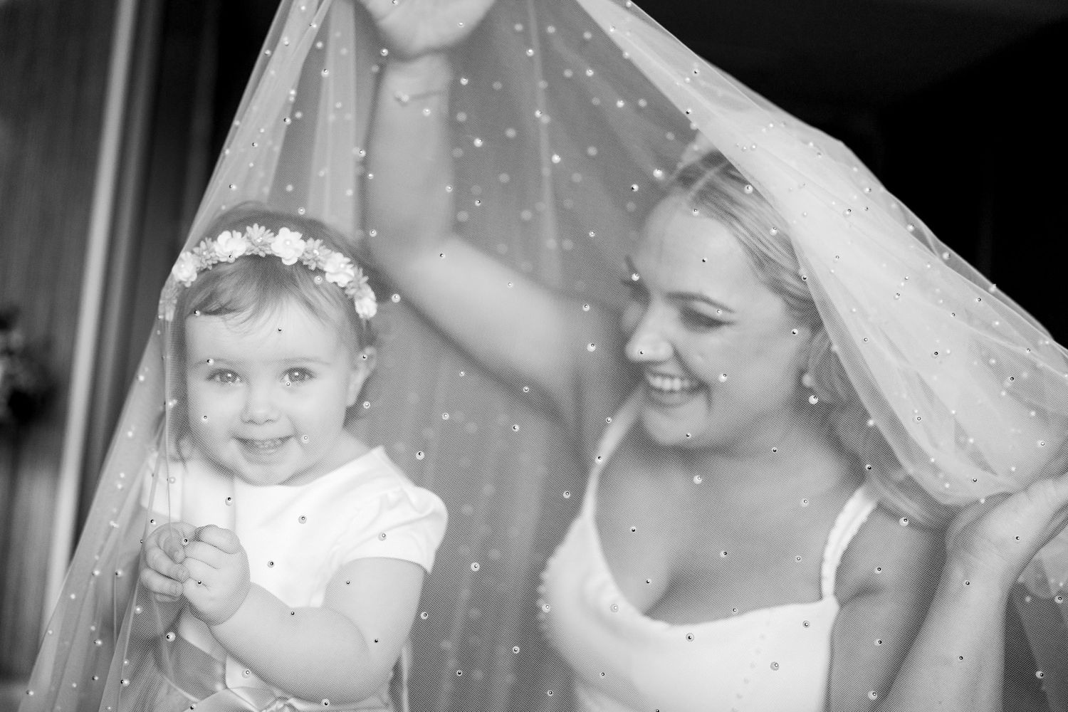 A touching black and white montage showing tender family moments between mother and baby through various stages.
