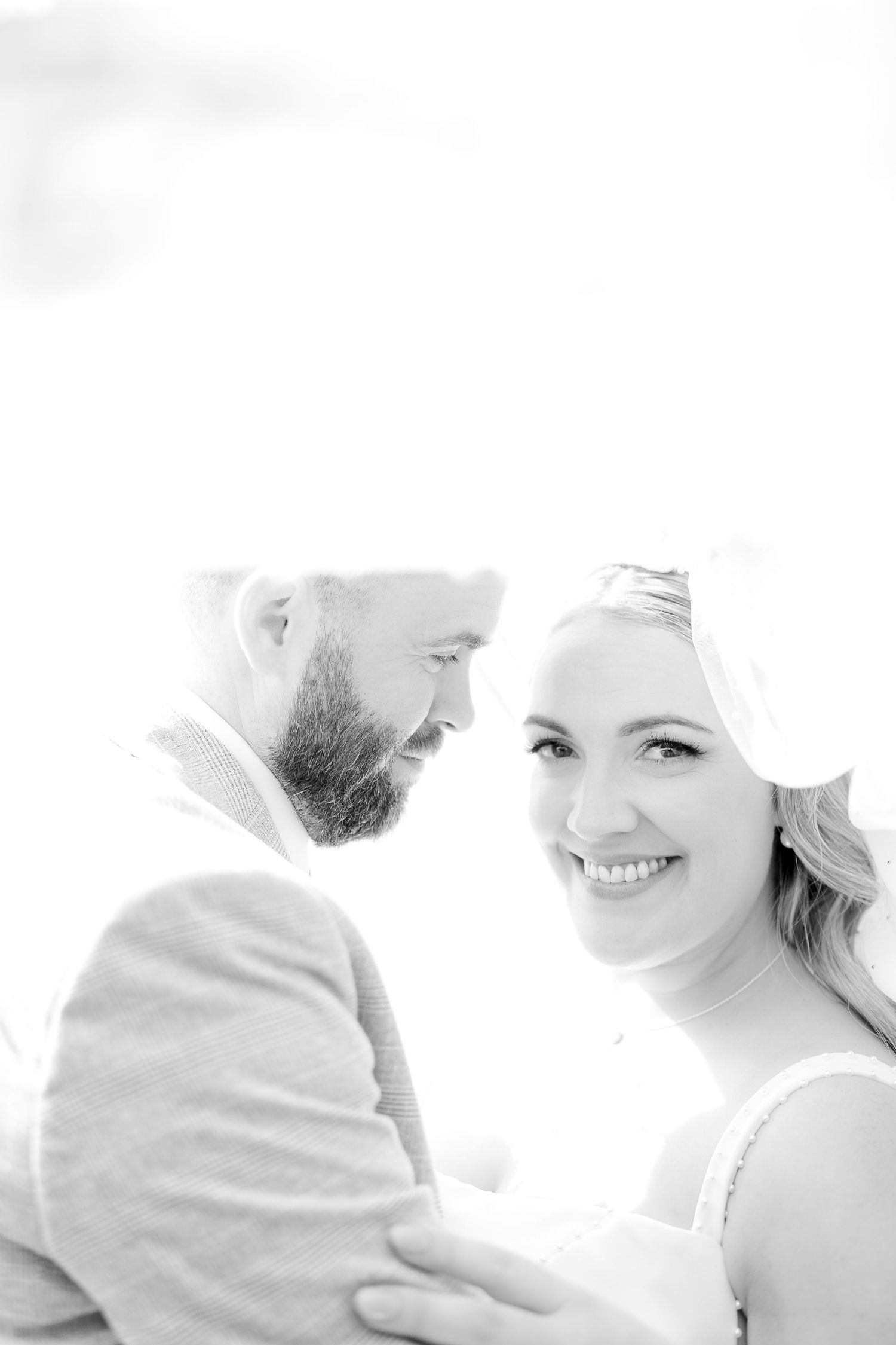 Several overlapping grayscale fashion headshots showing people in soft, ethereal lighting.