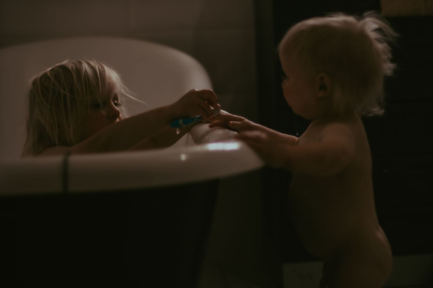 Siblings in the bath tub together