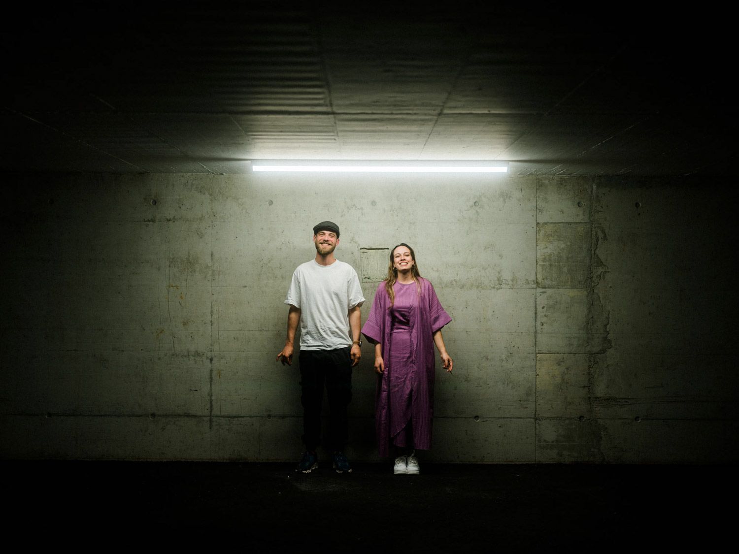 Alternative wedding photographer Portugal — couple in cinematic moment, underground hallway, artistic elopement vibe.