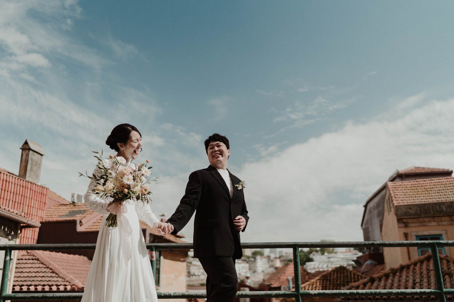 Joyful elopement couple smiling candidly during a rustic ceremony in Portugal — raw and cinematic style.