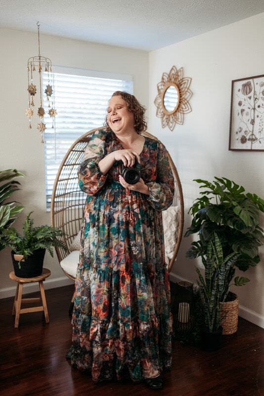 Jessica Life, a Friendly family photographer in Jacksonville FL smiling ready to chase your little kiddos around for great photos