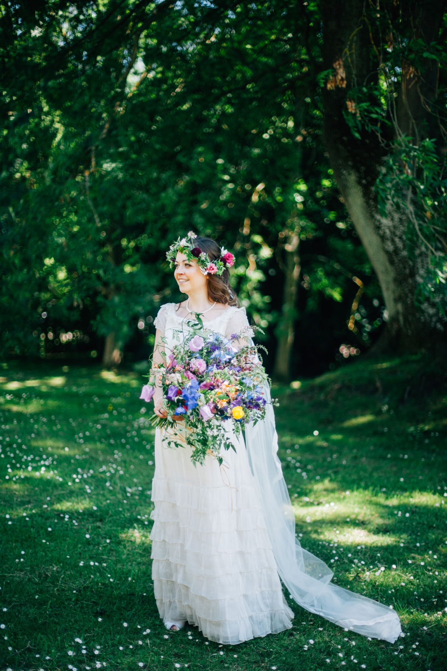 SOMERSET WEDDING PHOTOGRAPHER - Picture of a bride with a massive colourful bouquet of flowers and a beautiful fresh flower crown
