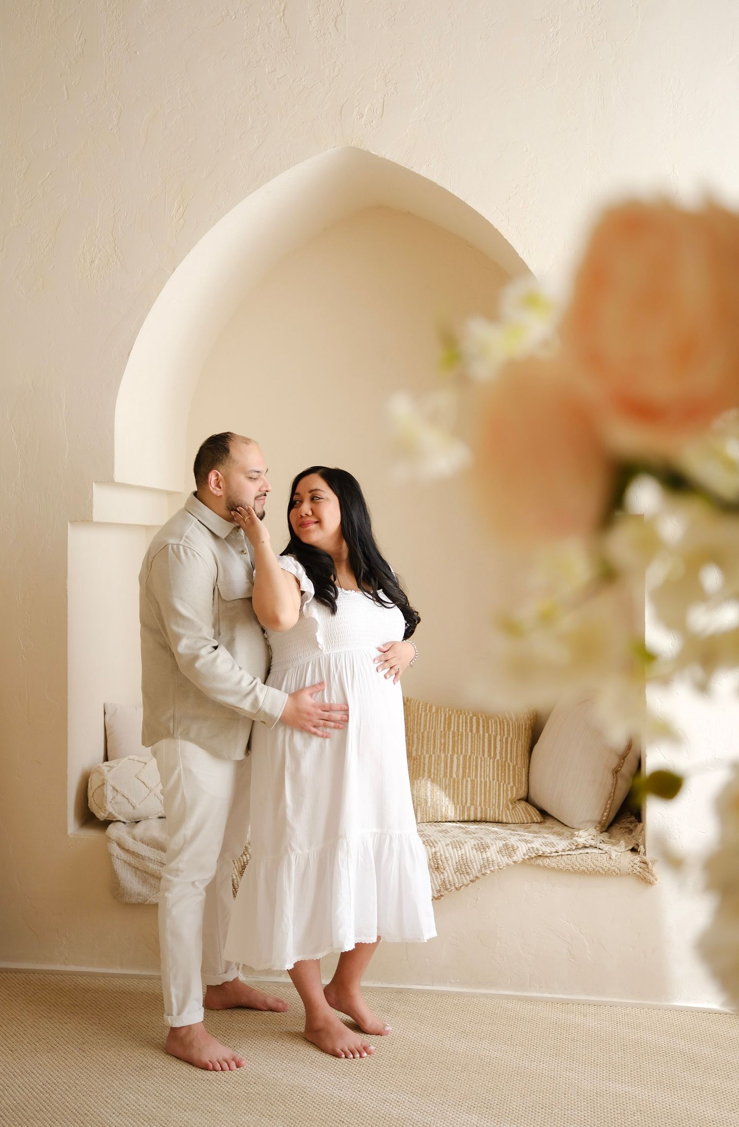 Romantic maternity portrait in white attire against neutral arched background Toronto, photographer, majestystudios, greater toronto area