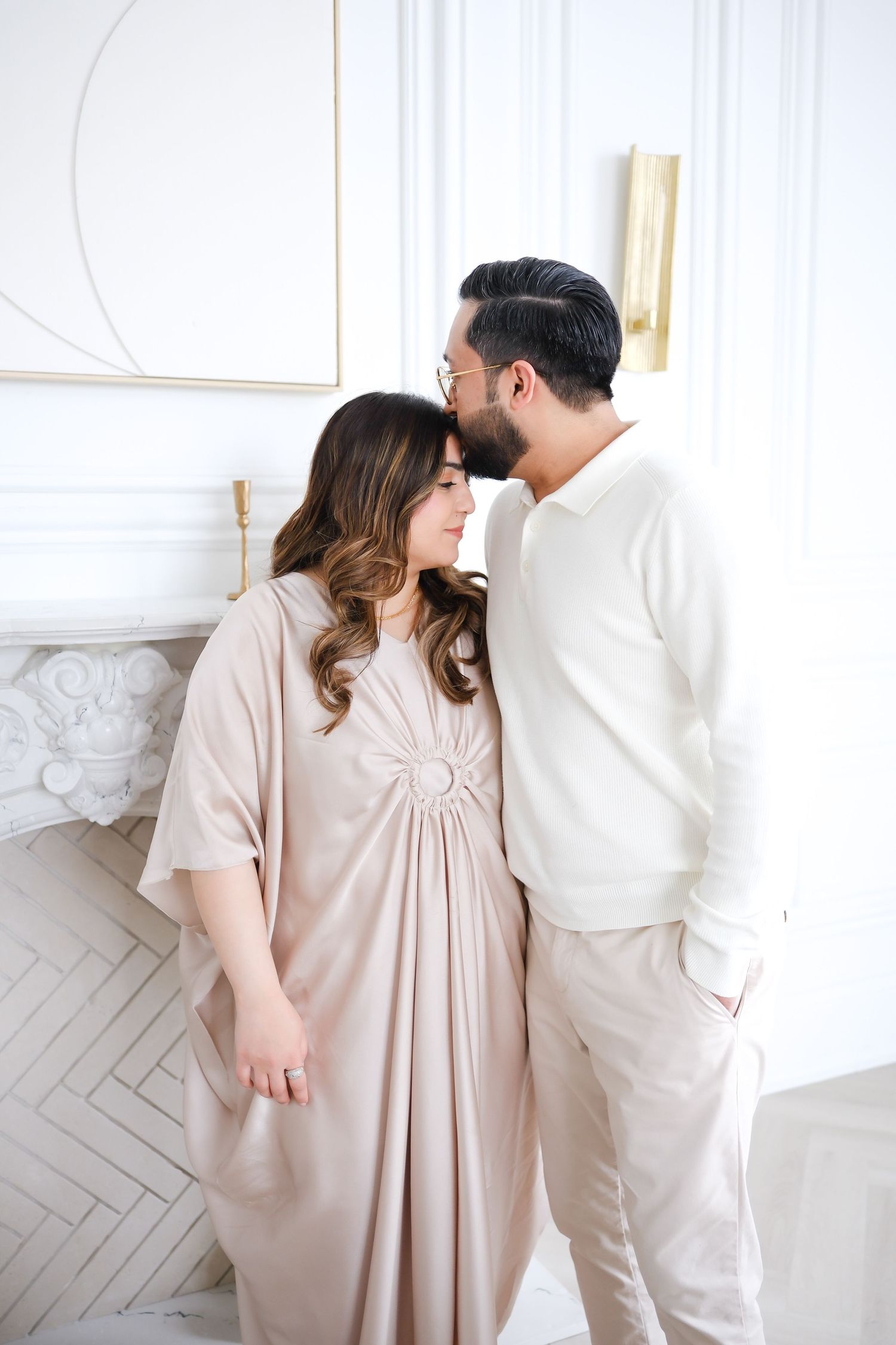 Romantic couple in neutral tones embracing in bright white room. Toronto, photographer, majestystudios, greater toronto area, family wedding