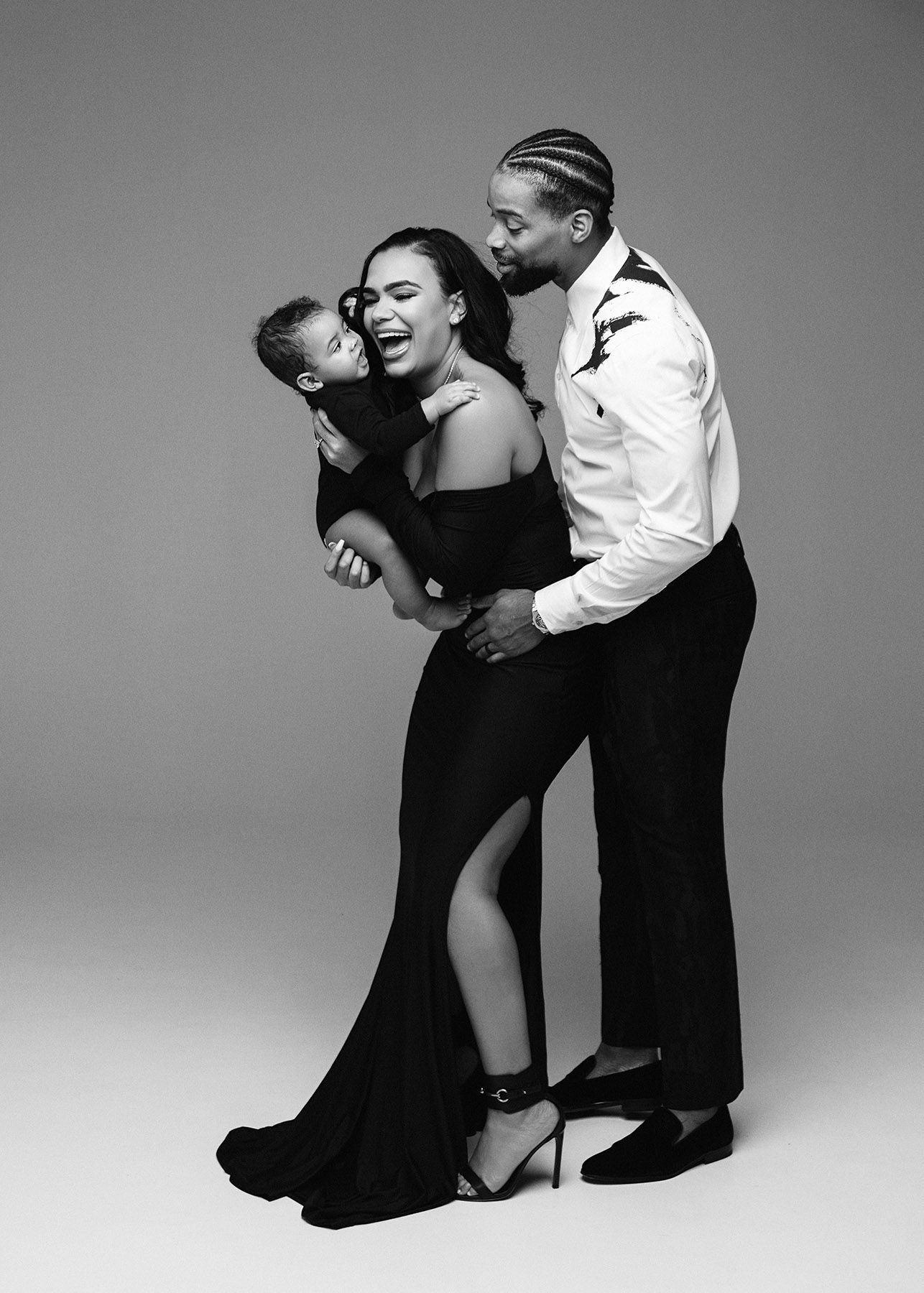 Black and white photo series showing a couple in dynamic dance poses, creating an elegant sequence of movement.