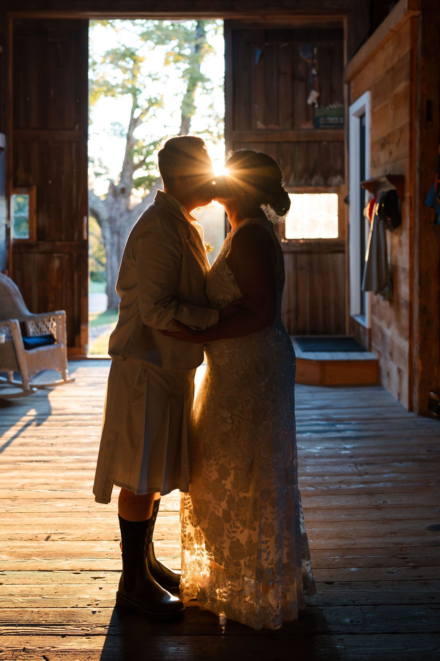 LGBTQ wedding couple kissing in a barn in Damariscotta, Maine