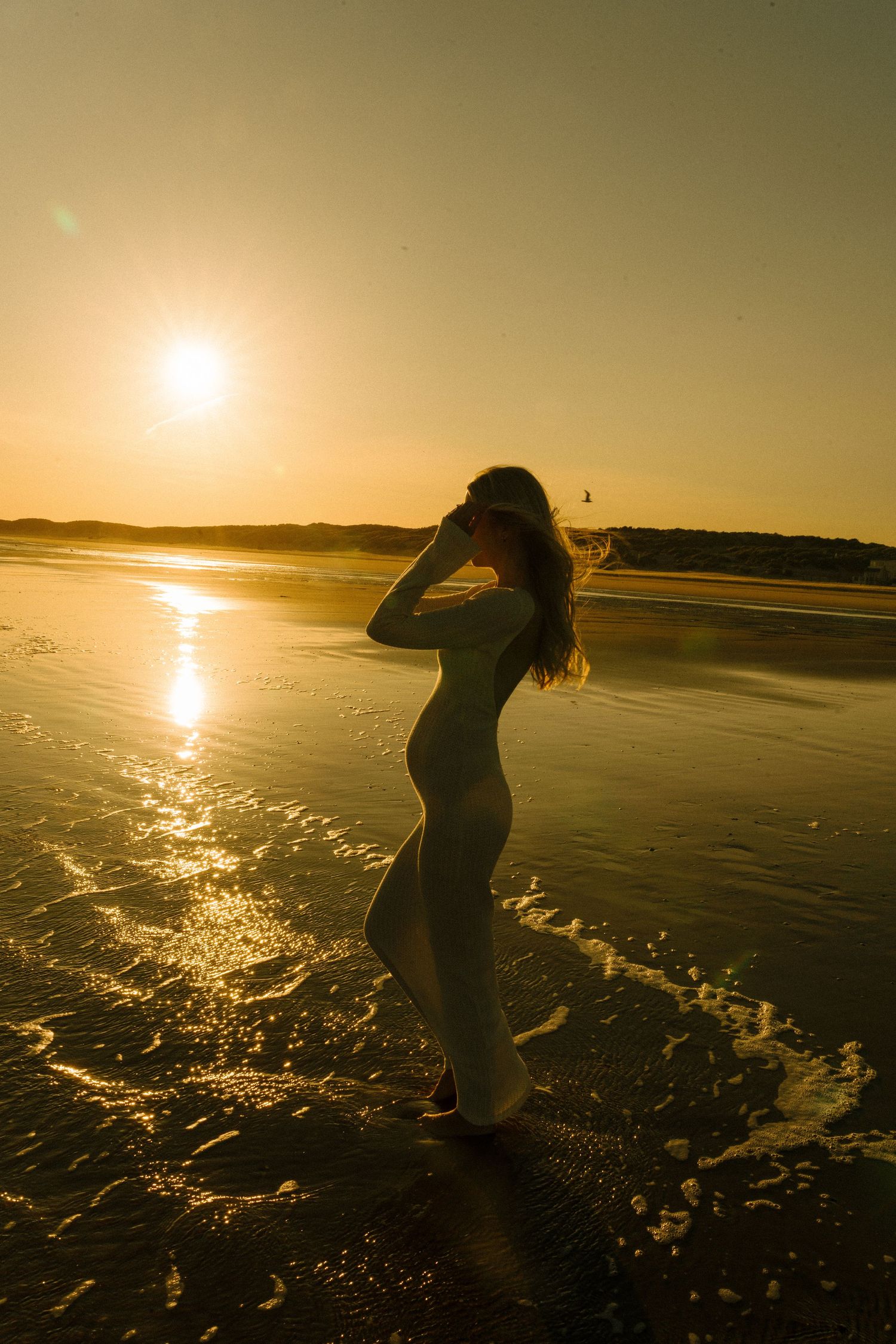 Relaxed sunset shoot by the sea, capturing movement, connection, and the joy of being barefoot outdoors. Camber Sands