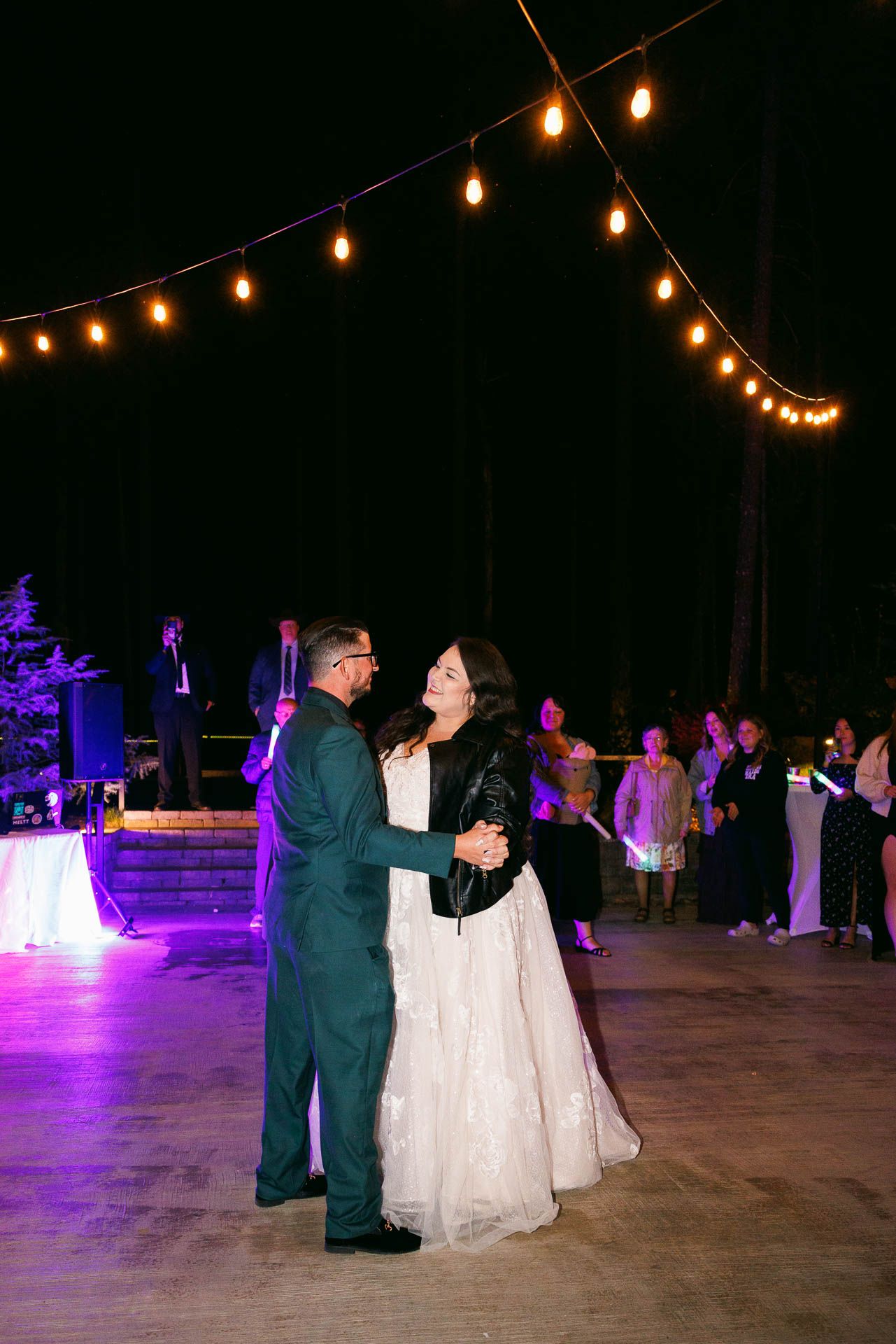 Couple sharing their first dance on an outdoor dance floor at Rocky Hill Venue in the Columbia River Gorge