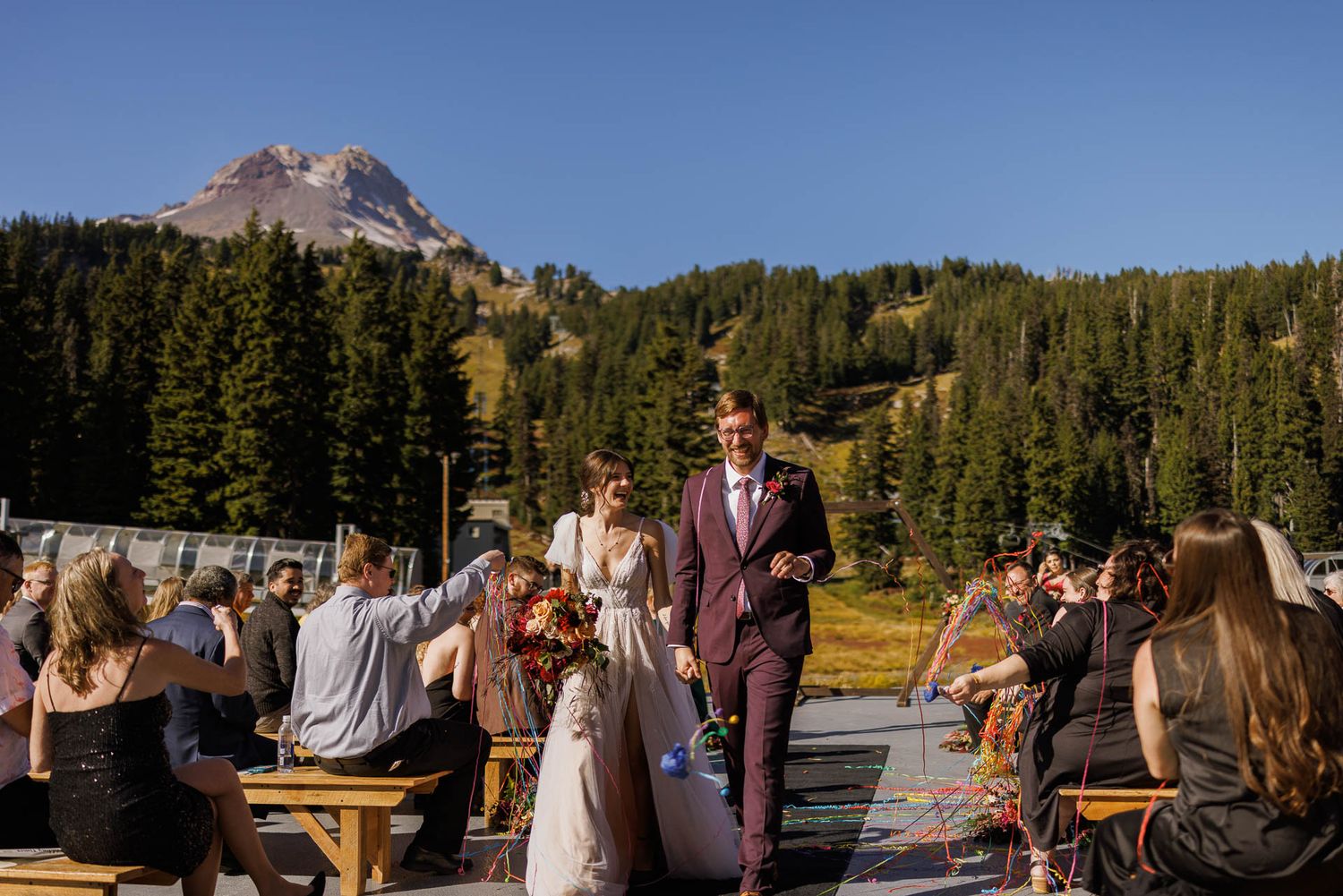 Bride and groom at Mt. Hood Meadows with mountain backdrop in fall colors | Oregon mountain wedding
