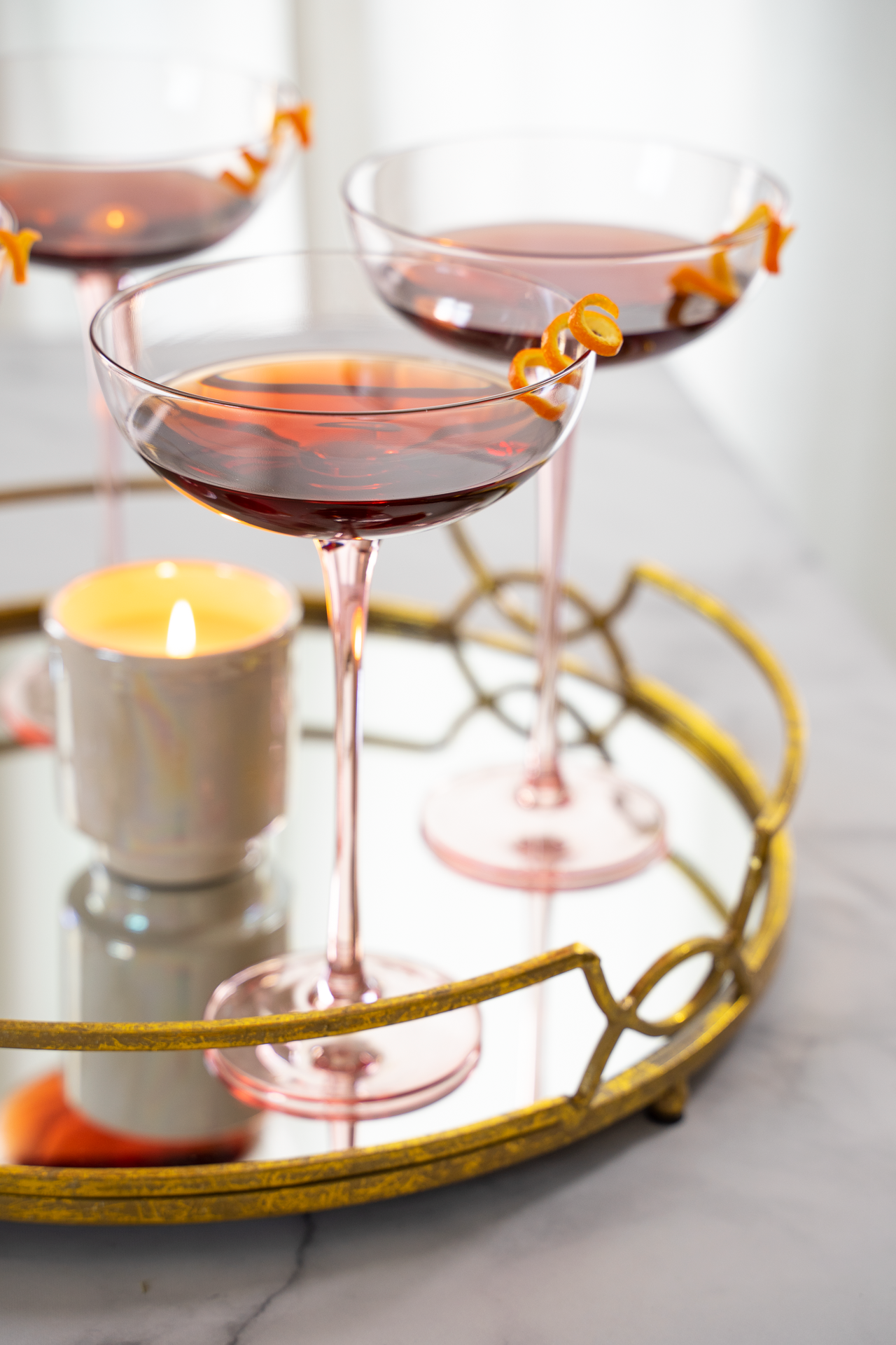 Styled cocktail photography with candlelight on mirrored tray, lifestyle brand imagery by San Diego photographer Dolce Vita Studio.