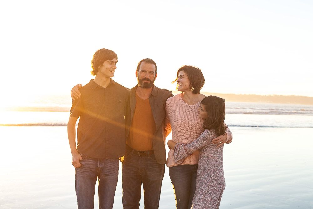 San Diego family beach portrait—natural light lifestyle photography of a happy family of four by Dolce Vita Studio.