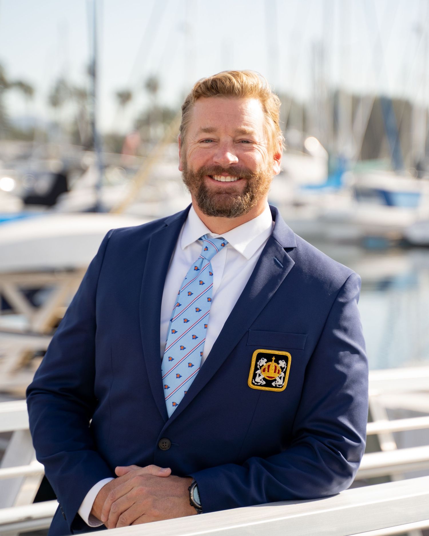 Formal portrait of yacht club leadership team member – coastal background and classic styling