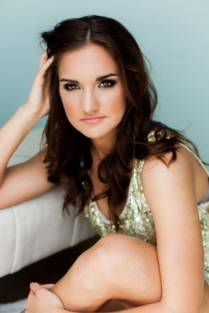 a seductive portrait of a woman in glam pose for a styled portrait session in San Diego, California