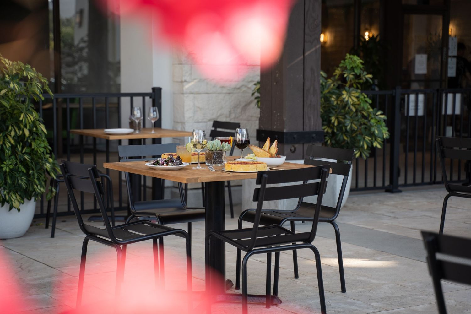 Softly hidden moments—table for two through a dreamy floral lens